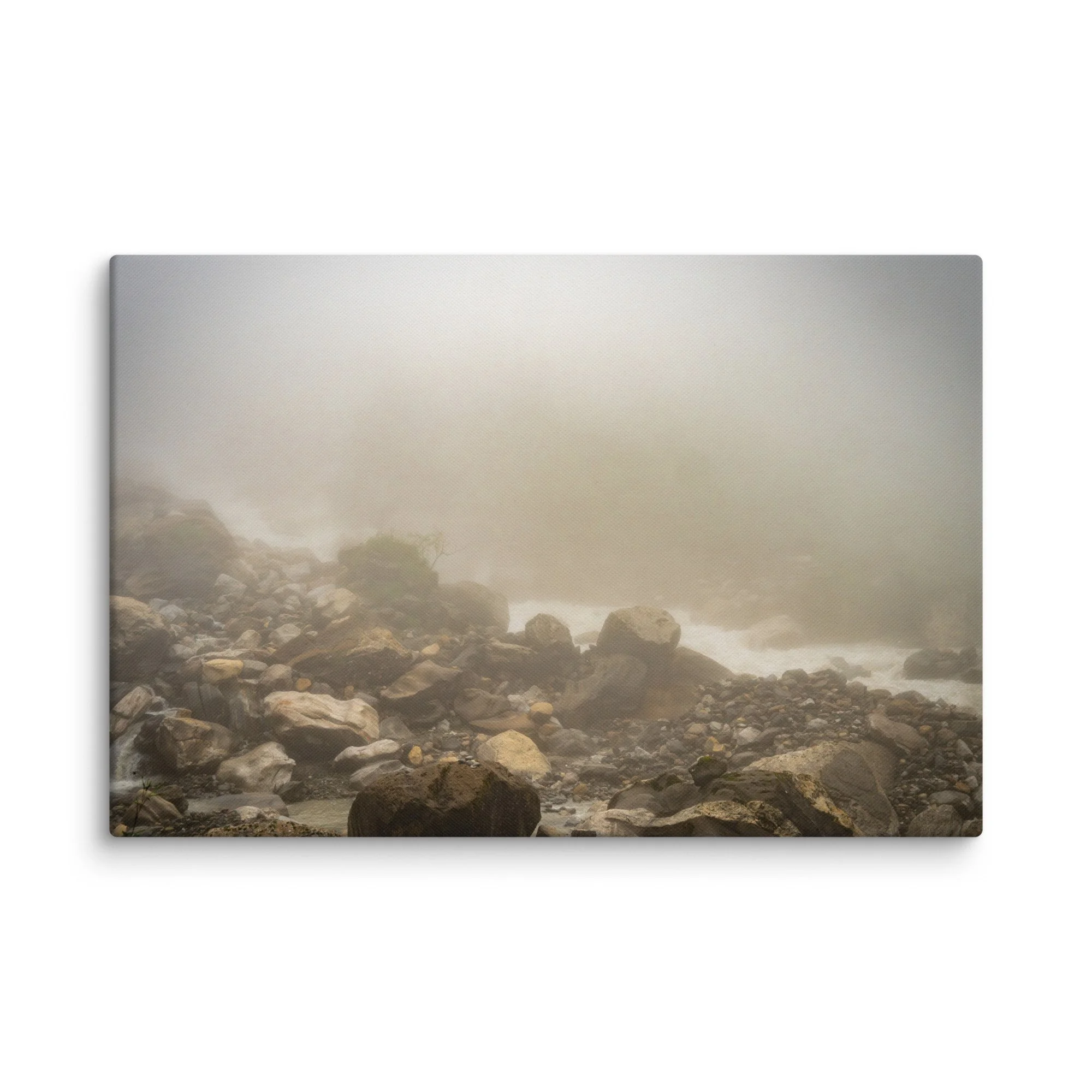 Misty glacial river valley with rounded boulders and gentle rapids on the Annapurna Circuit/Base Camp Trek, Nepal, shrouded in thick fog – high-altitude trekking travel photography