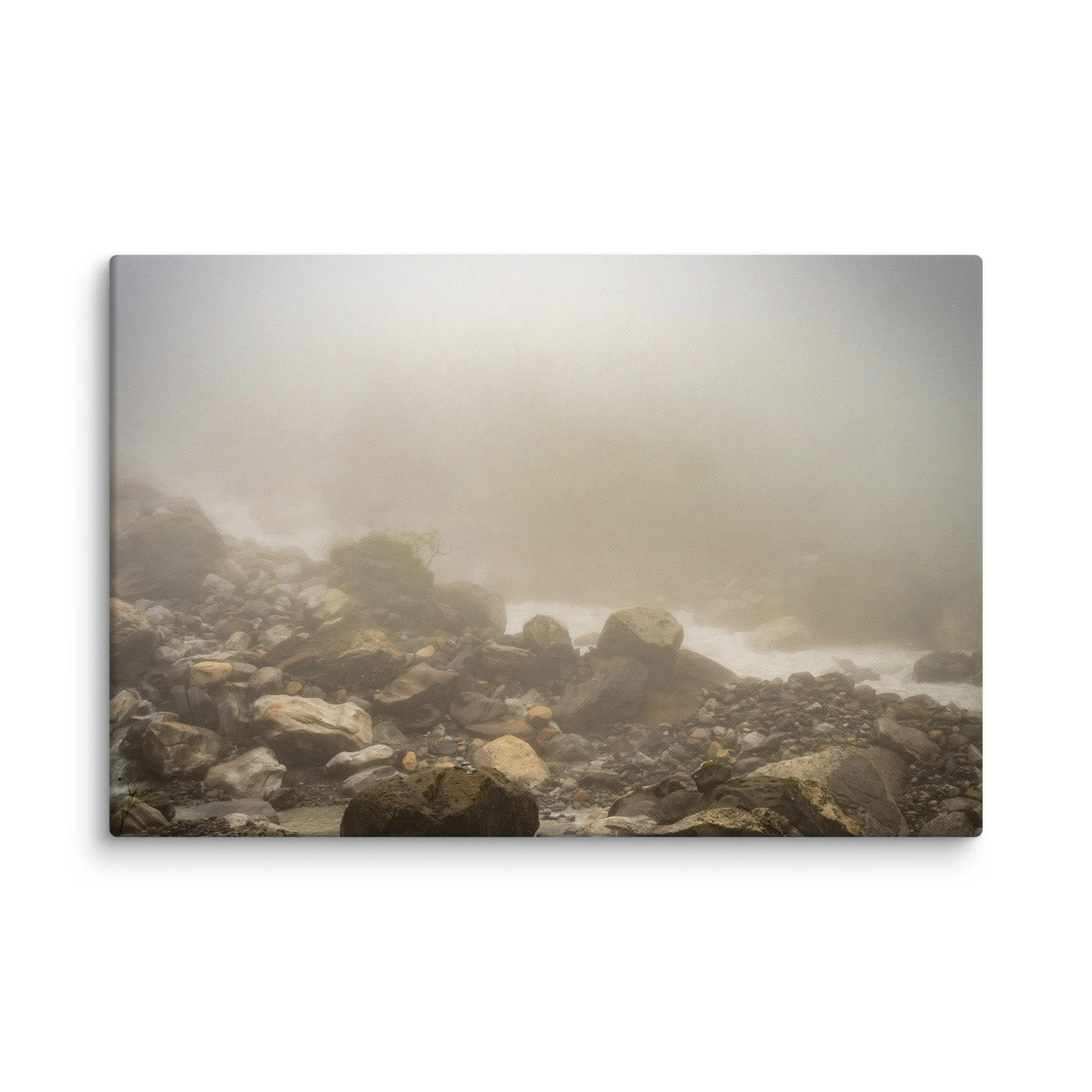 Misty glacial river valley with rounded boulders and gentle rapids on the Annapurna Circuit/Base Camp Trek, Nepal, shrouded in thick fog – high-altitude trekking travel photography
