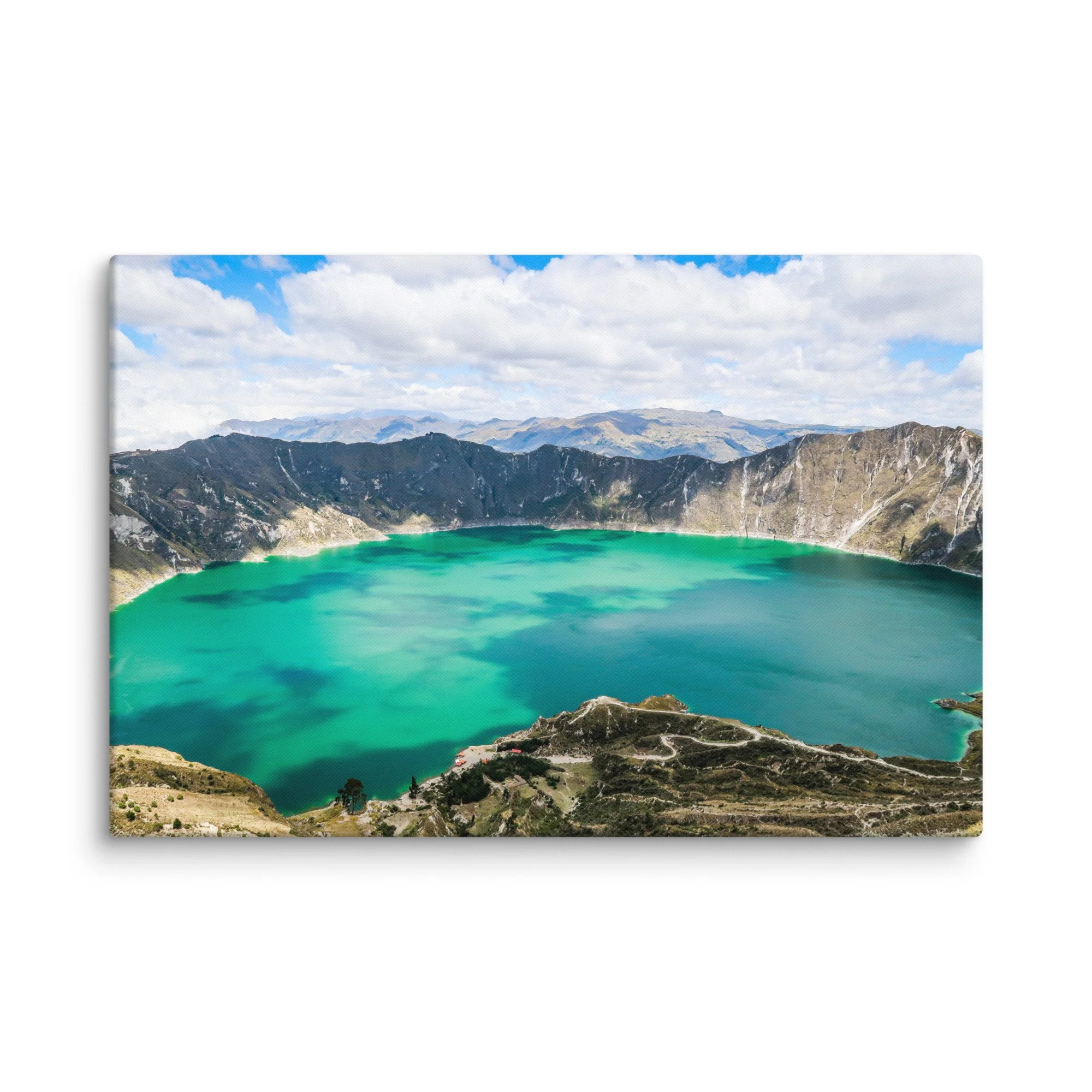 Panoramic view of vibrant turquoise Quilotoa Lagoon crater from the rim, surrounded by rugged volcanic walls and distant Andean peaks, Ecuador – high-altitude trekking travel