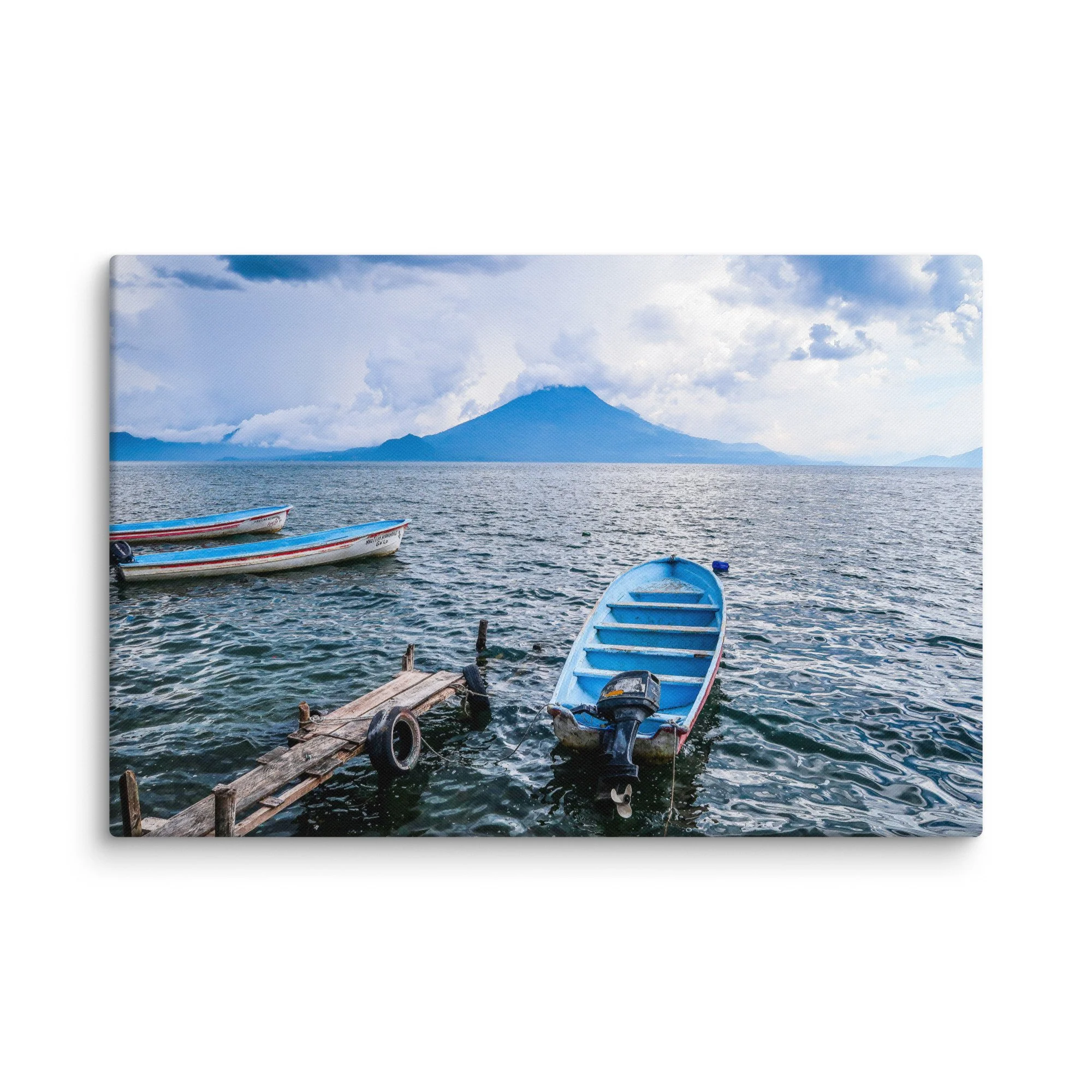Traditional wooden boats floating on turquoise Lake Atitlán with towering Volcán San Pedro in the background, Guatemala – tropical volcanic lake travel photography canvas print wall art decor