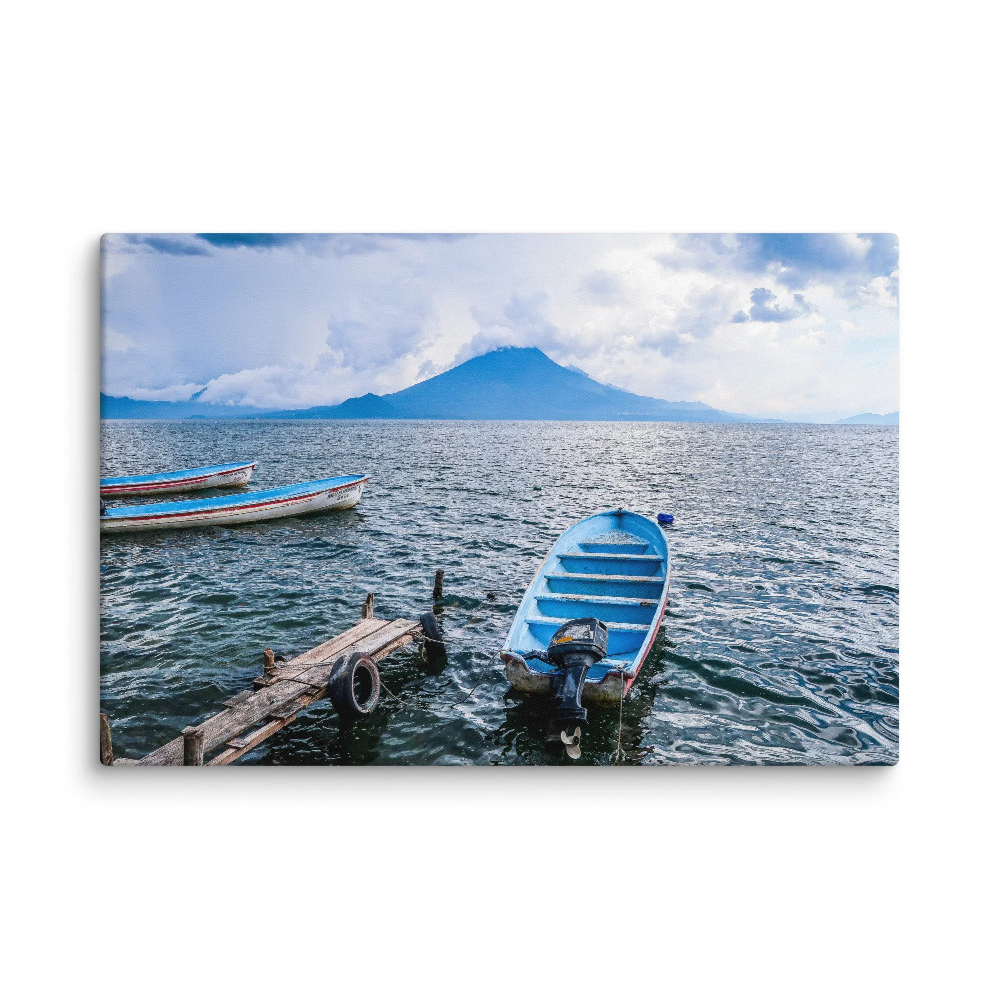 Traditional wooden boats floating on turquoise Lake Atitlán with towering Volcán San Pedro in the background, Guatemala – tropical volcanic lake travel photography canvas print wall art decor