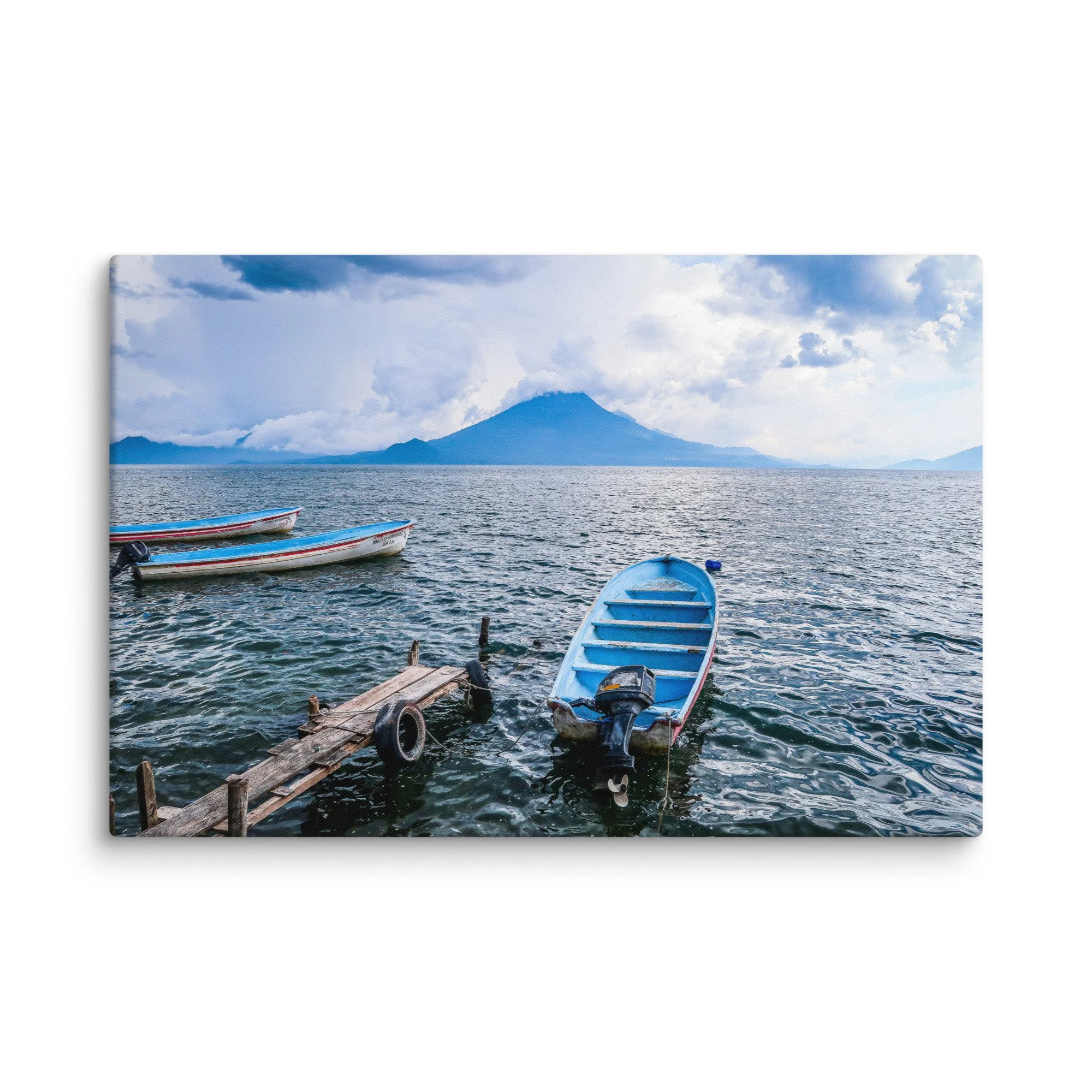 Traditional wooden boats floating on turquoise Lake Atitlán with towering Volcán San Pedro in the background, Guatemala – tropical volcanic lake travel photography canvas print wall art decor