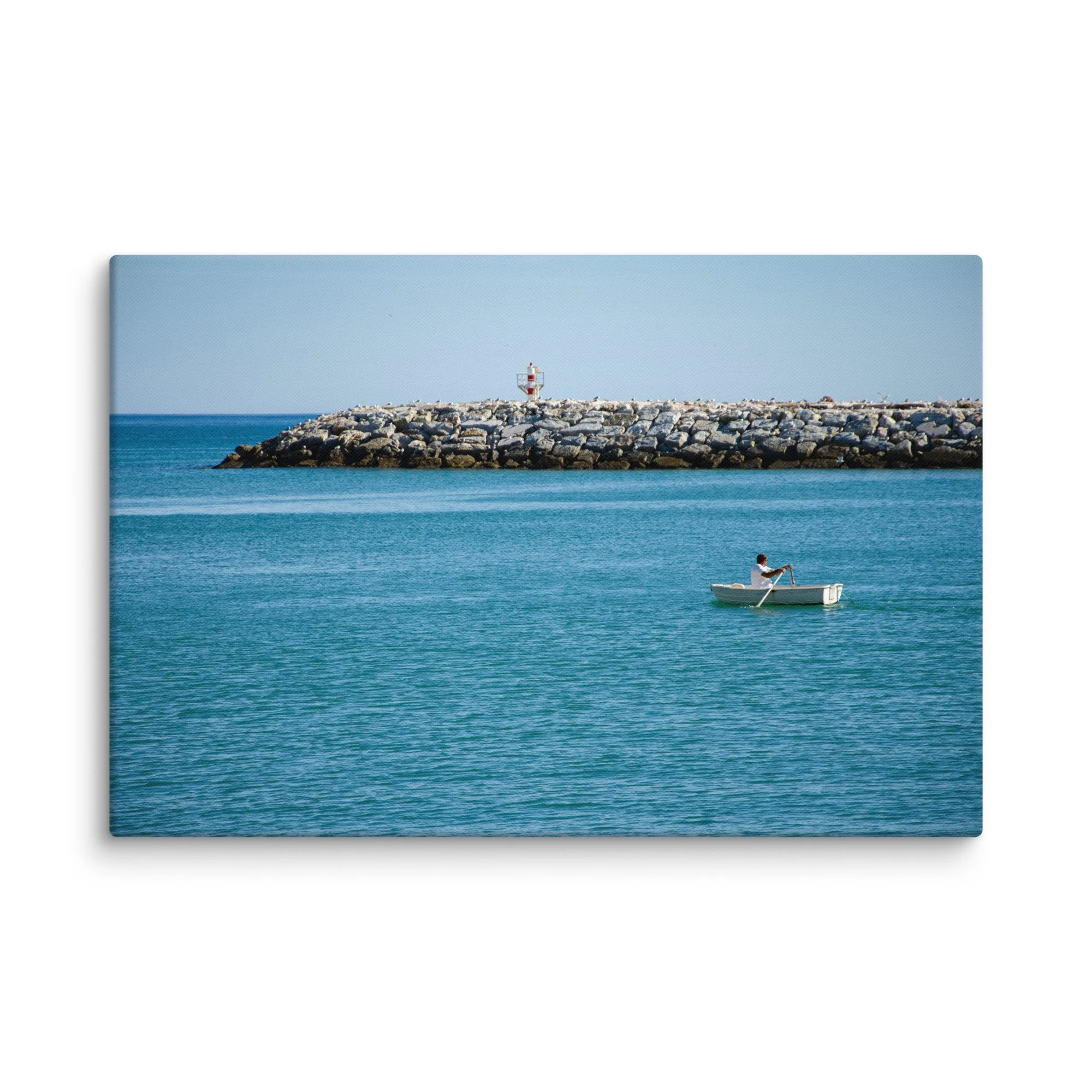 Fisherman rowing a white boat toward a red-and-white lighthouse on a stone breakwater with seabirds, turquoise Atlantic waters, Ireland – Celtic coastal travel photography canvas print