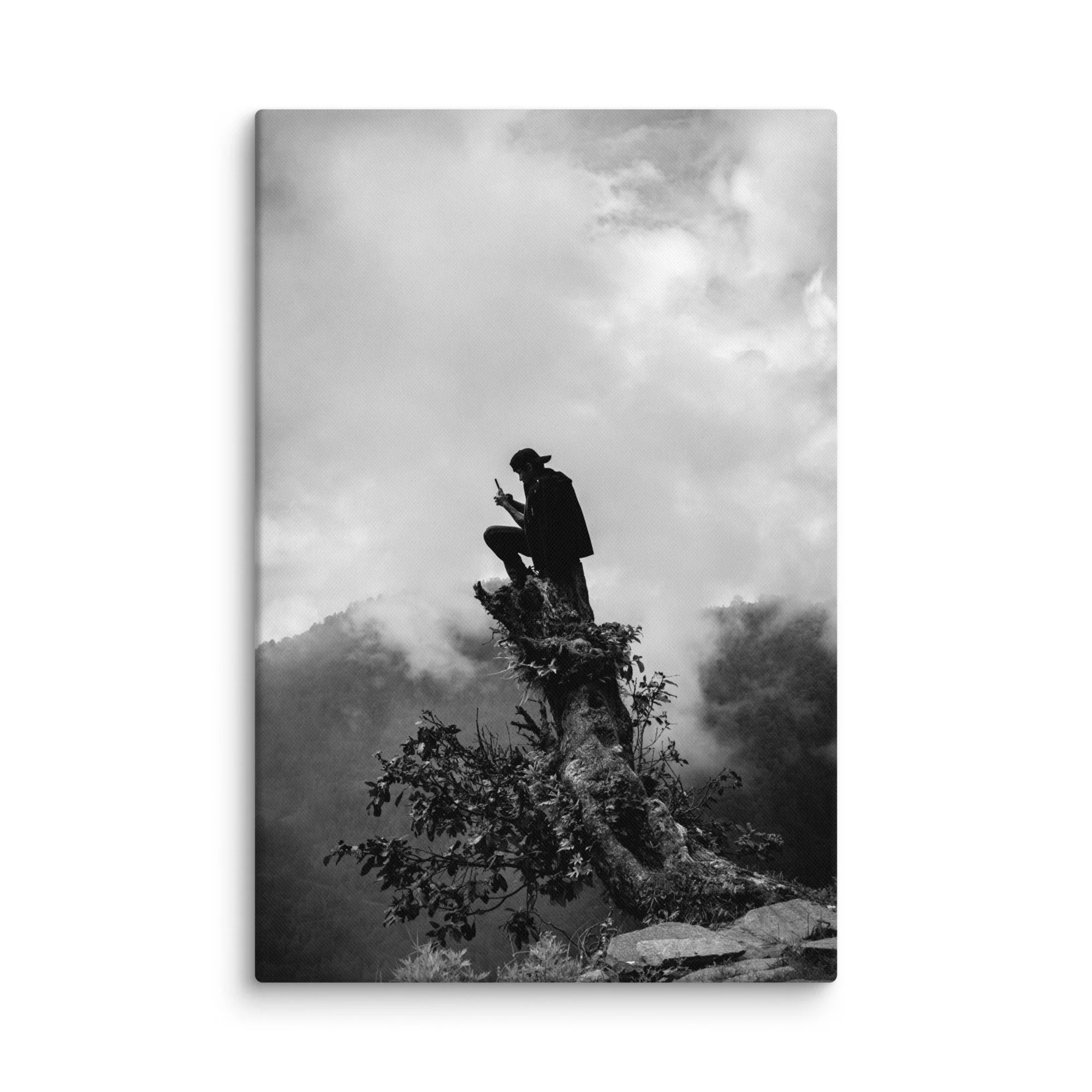 Lone trekker in cloak perched on ancient tree stump atop misty Annapurna ridge, overlooking foggy Himalayan valleys, Nepal – high-altitude trekking travel photography canvas print