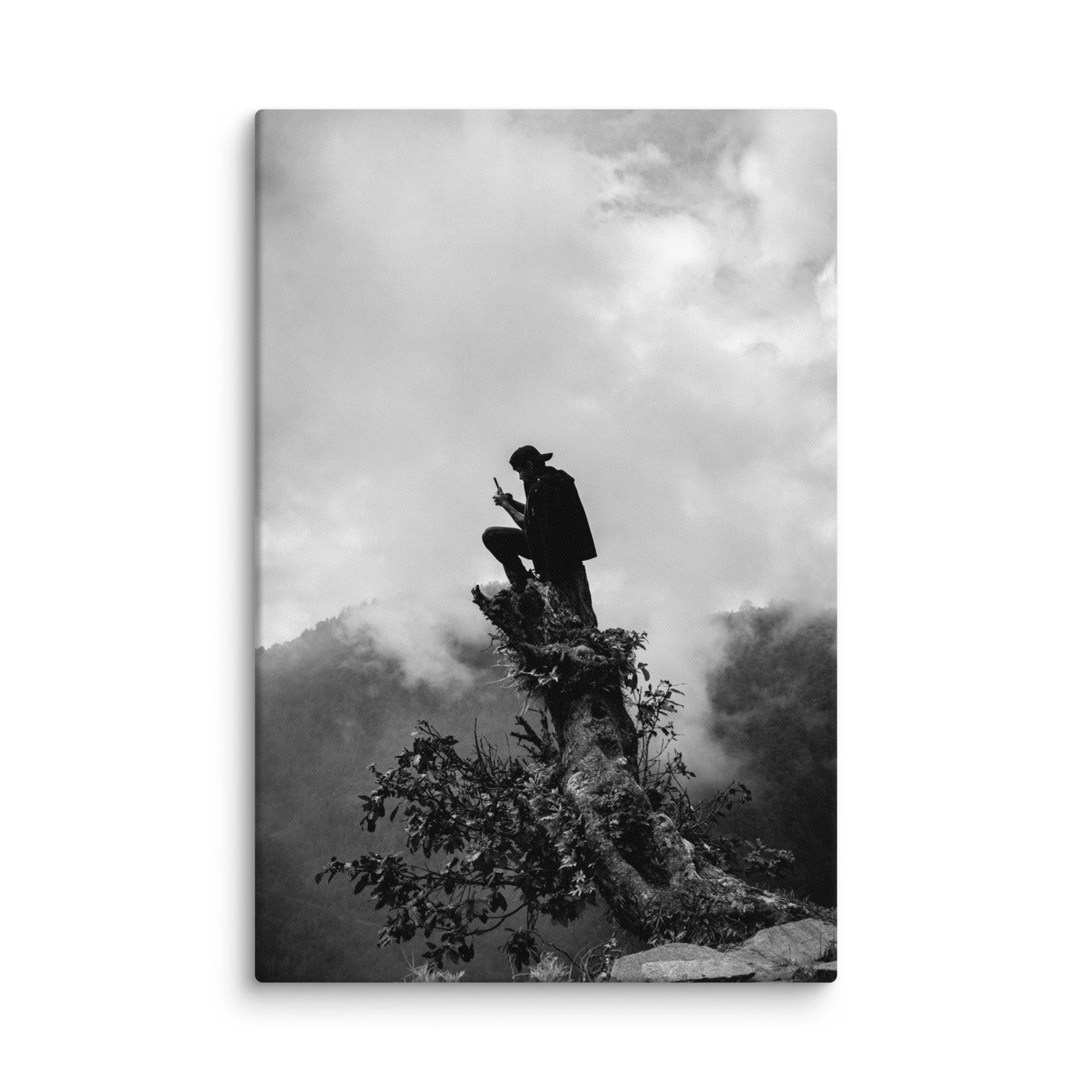 Lone trekker in cloak perched on ancient tree stump atop misty Annapurna ridge, overlooking foggy Himalayan valleys, Nepal – high-altitude trekking travel photography canvas print
