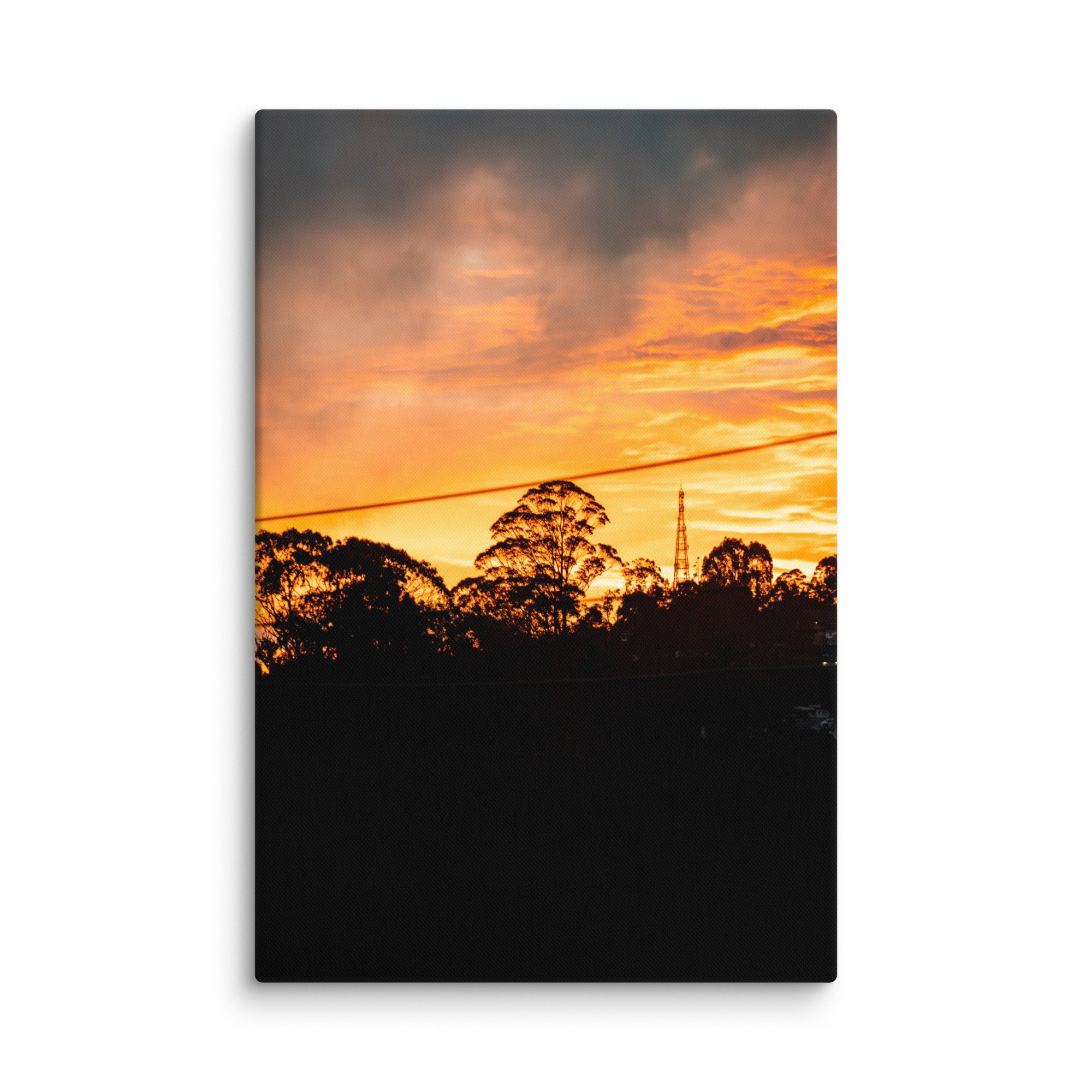 Silhouetted eucalyptus trees and radio tower against dramatic golden sunset in misty Nilgiri hills, Tamil Nadu, South India – highland travel photography canvas print wall art decor