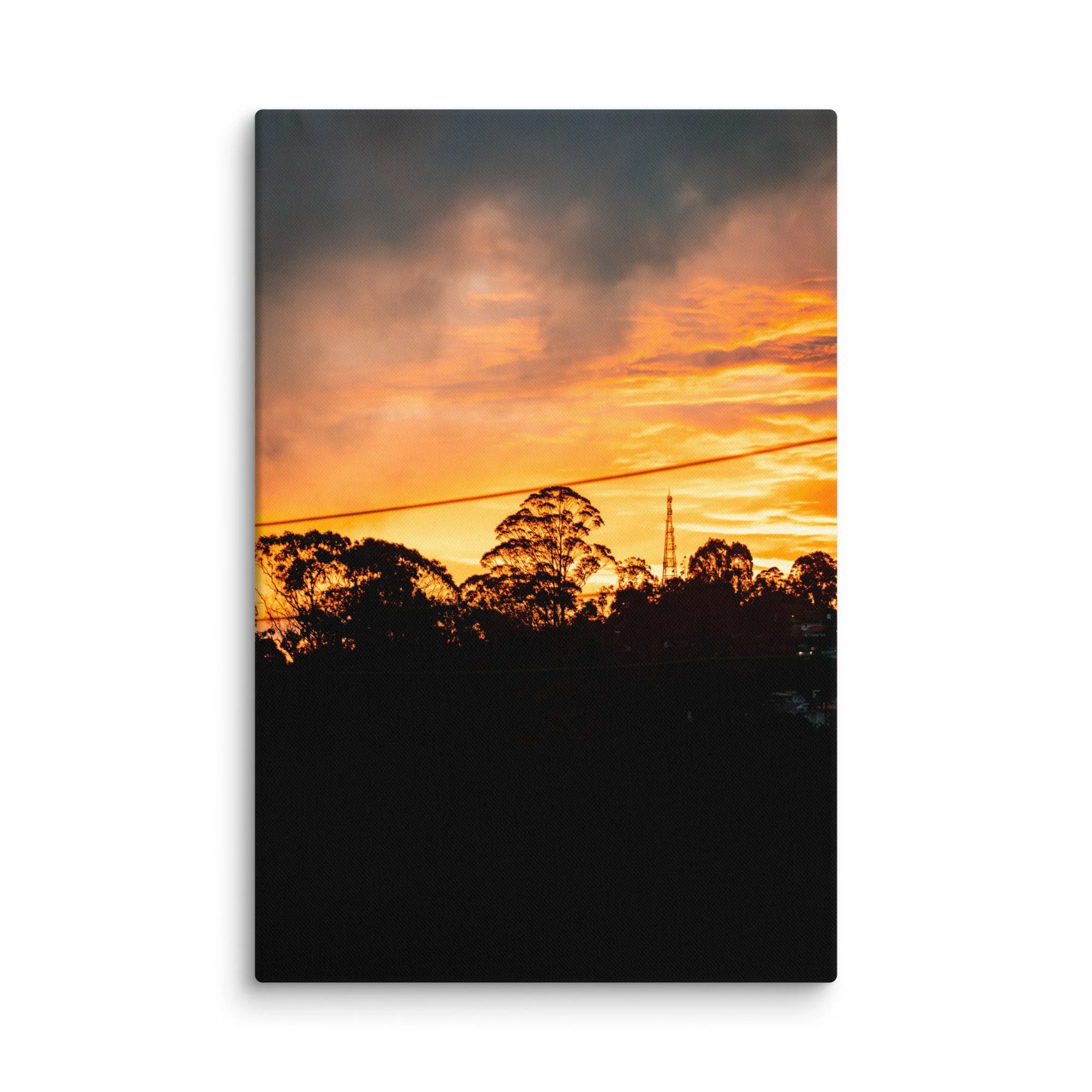 Silhouetted eucalyptus trees and radio tower against dramatic golden sunset in misty Nilgiri hills, Tamil Nadu, South India – highland travel photography canvas print wall art decor