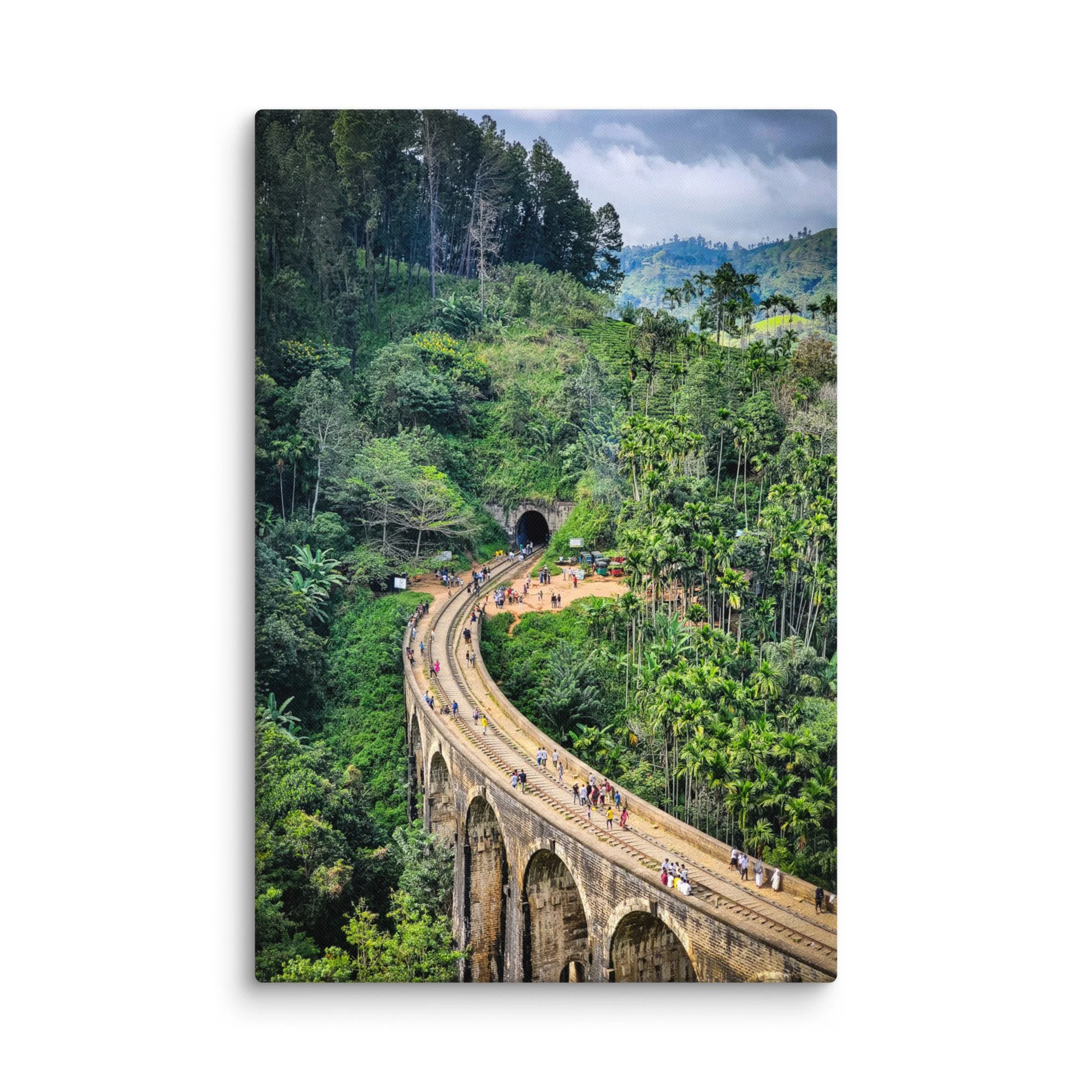 Historic Nine Arch Bridge in Ella, Sri Lanka, curving through lush tea plantations and tropical jungle with tourists walking on tracks – travel photography canvas print wall art decor