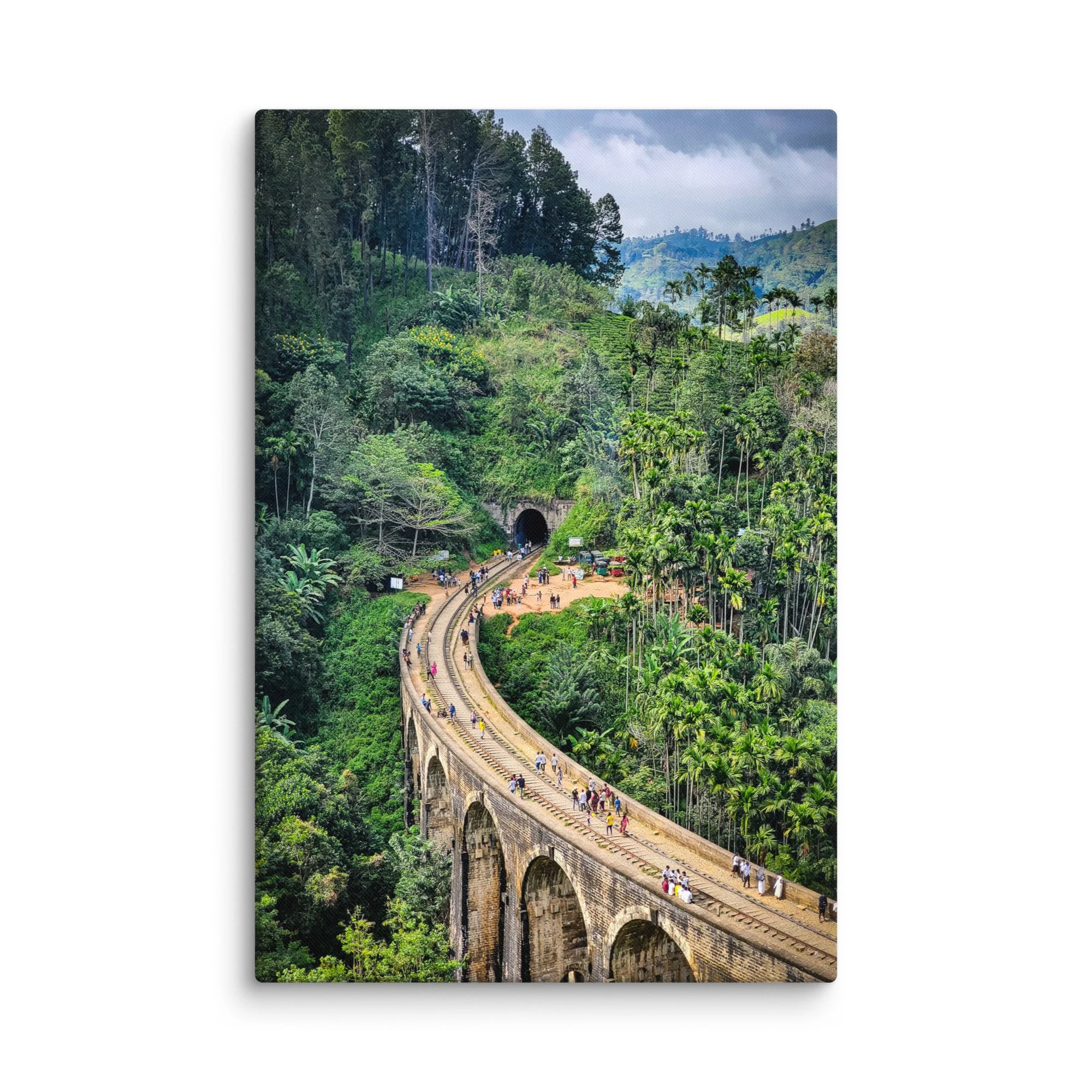 Historic Nine Arch Bridge in Ella, Sri Lanka, curving through lush tea plantations and tropical jungle with tourists walking on tracks – travel photography canvas print wall art decor