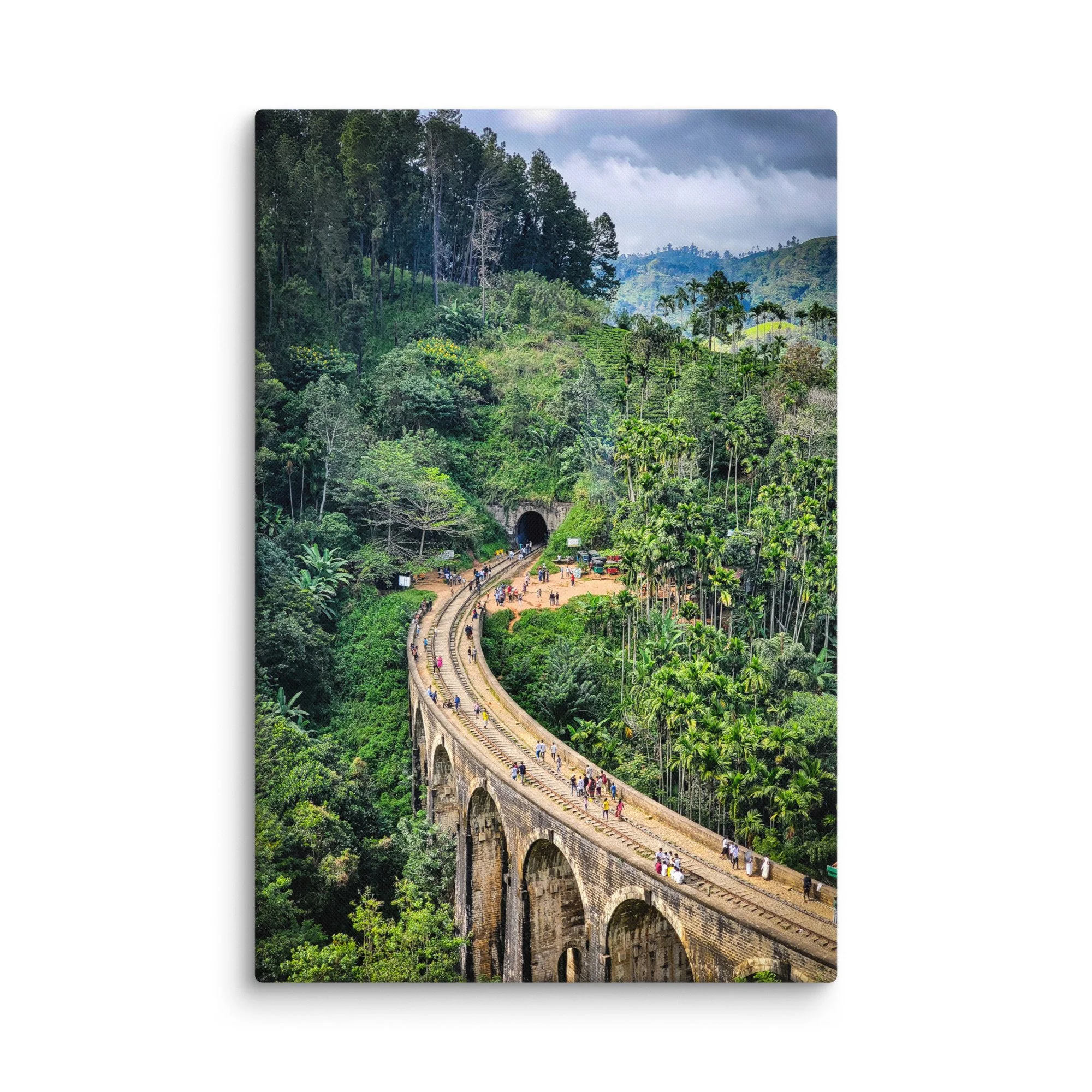 Historic Nine Arch Bridge in Ella, Sri Lanka, curving through lush tea plantations and tropical jungle with tourists walking on tracks – travel photography canvas print wall art decor