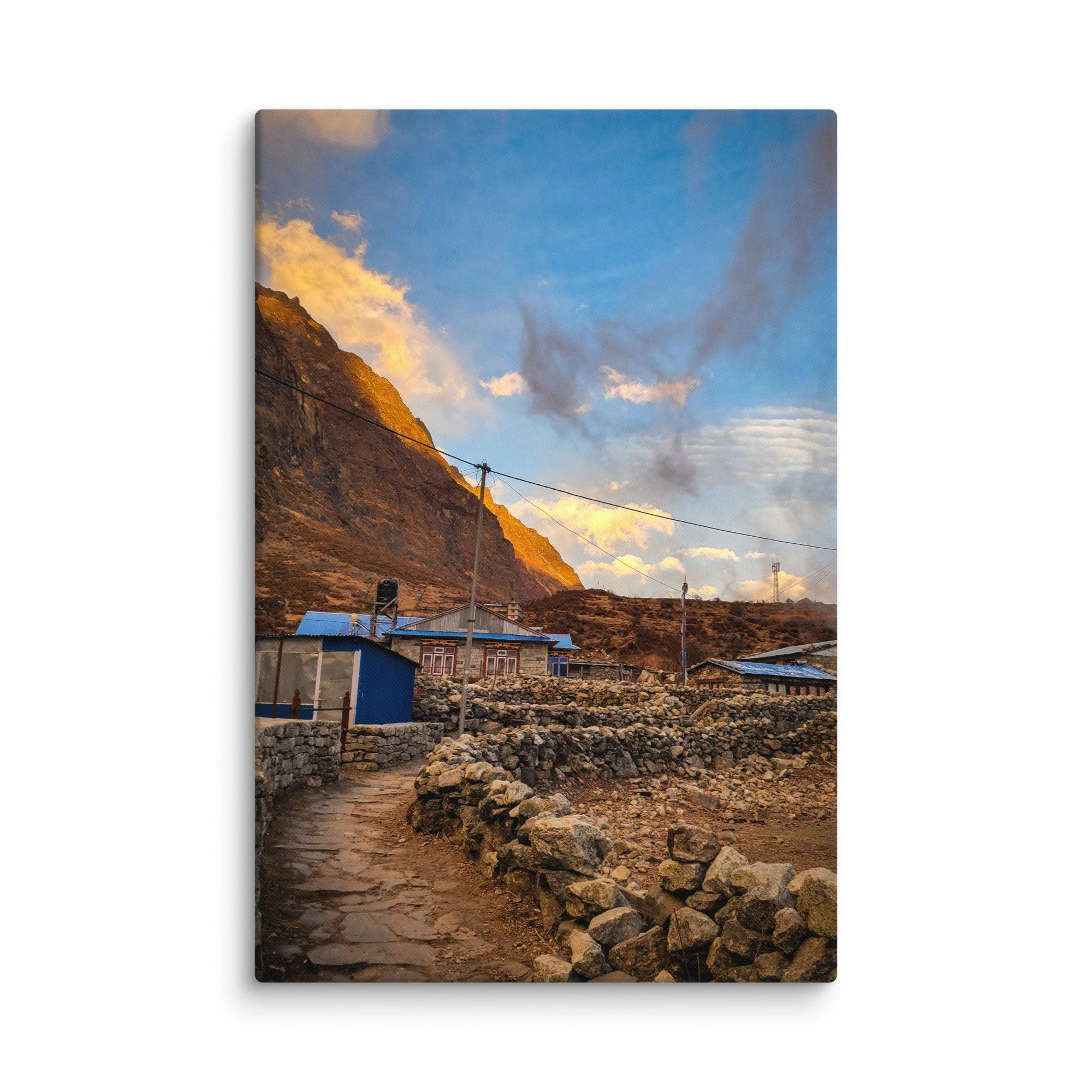Traditional stone teahouses and lodges in Langtang Valley village at golden sunset, with dramatic snow-capped peaks and misty mountains, Nepal – Himalayan trekking travel photography