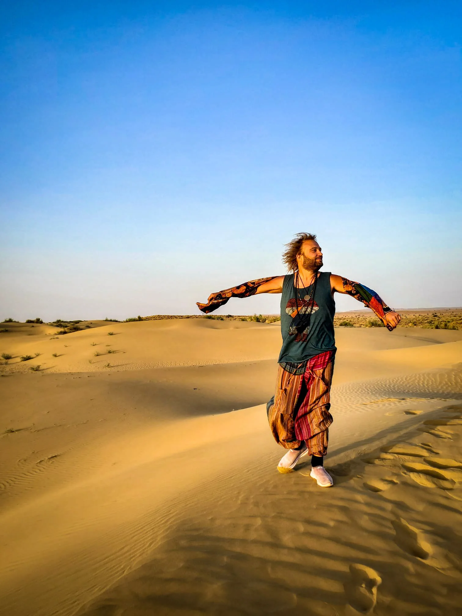 artist Jadoo walking through desert