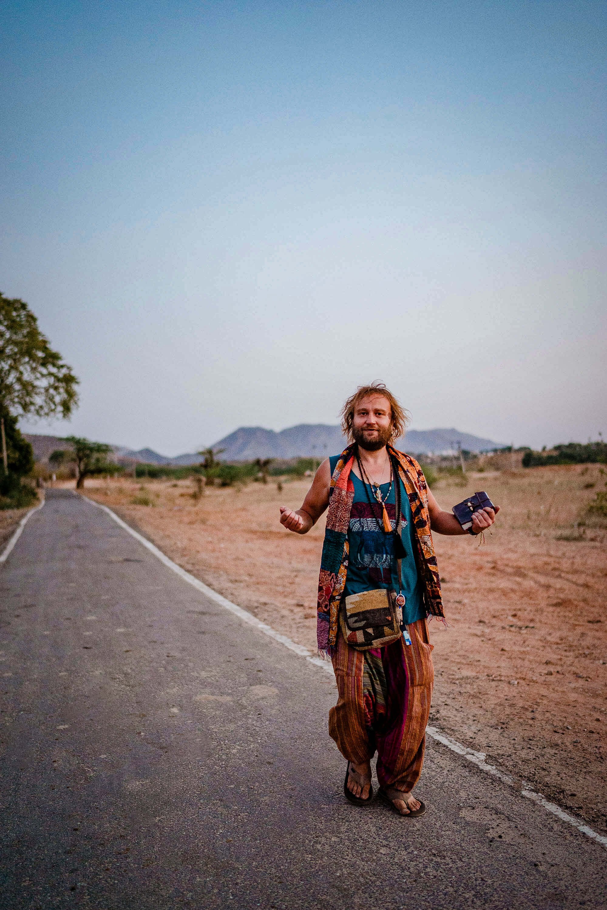 artist jadoo walking in the desert