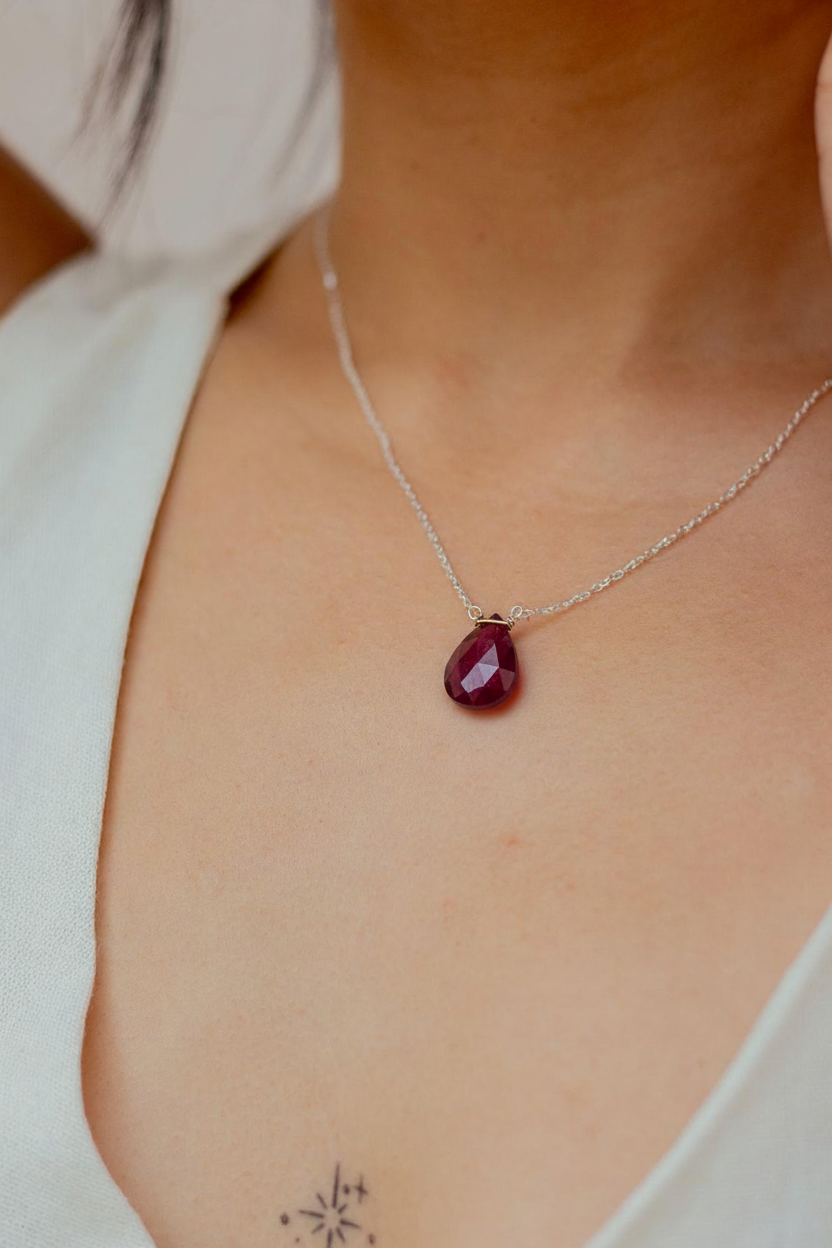 silver garnet on neck.png