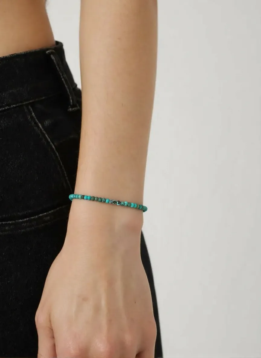 Turq kali on wrist front.png