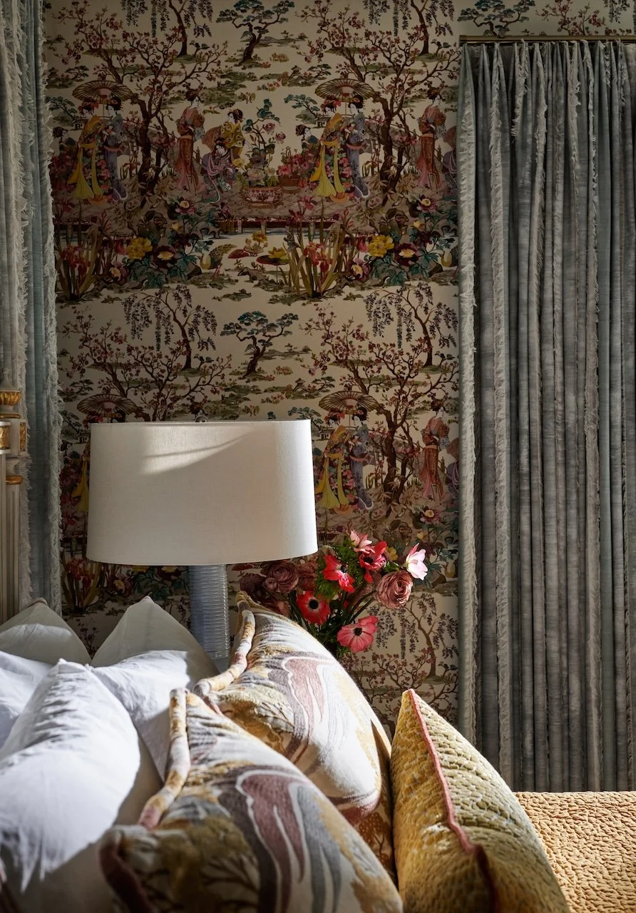 bedroom chinoiserie wallpaper fringed velvet drapes marbleized pillows crisp linens and fresh blooms
