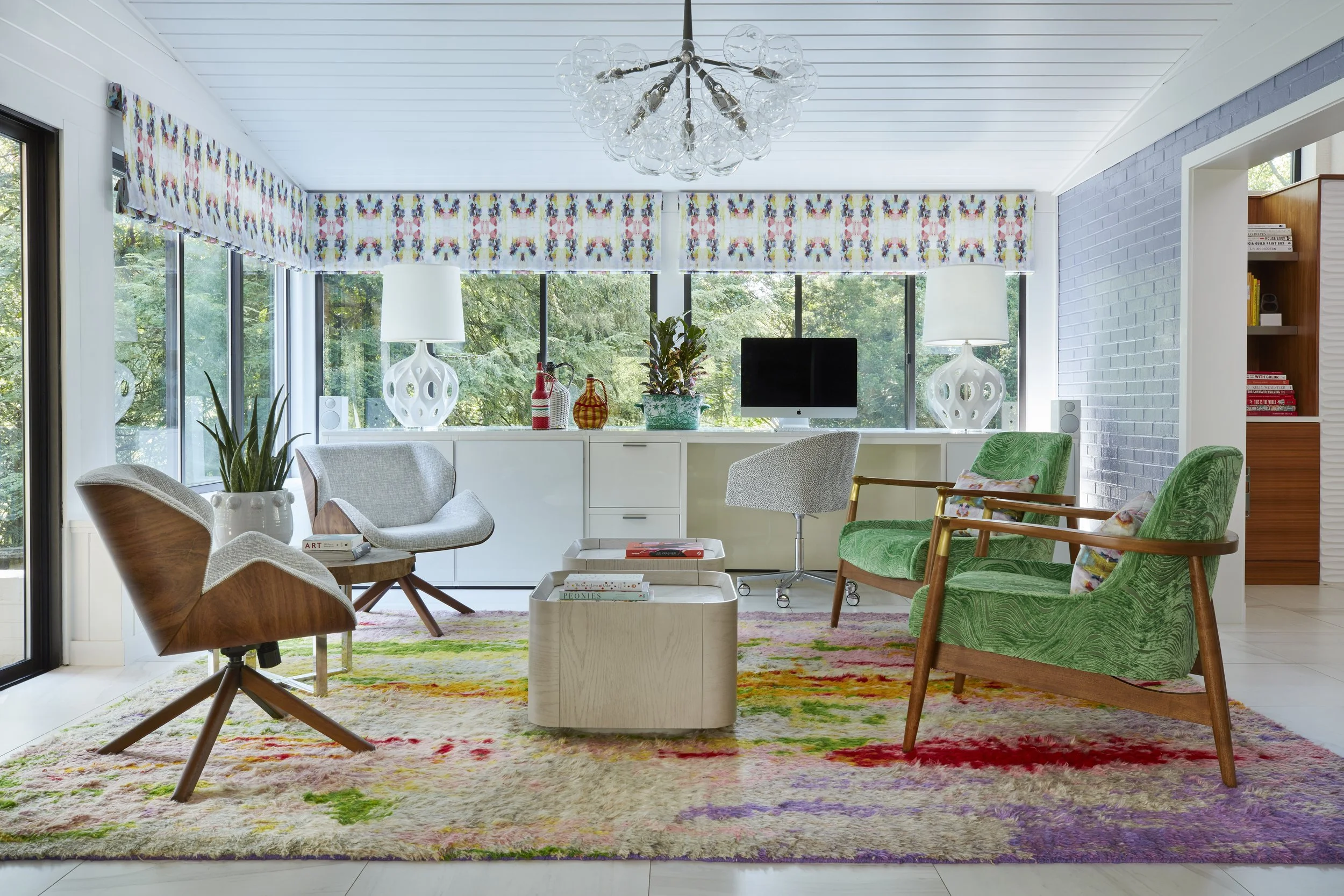 colorful modern home office with white desk green armchairs wooden accent chair multicolor rug patterned valances chic lighting