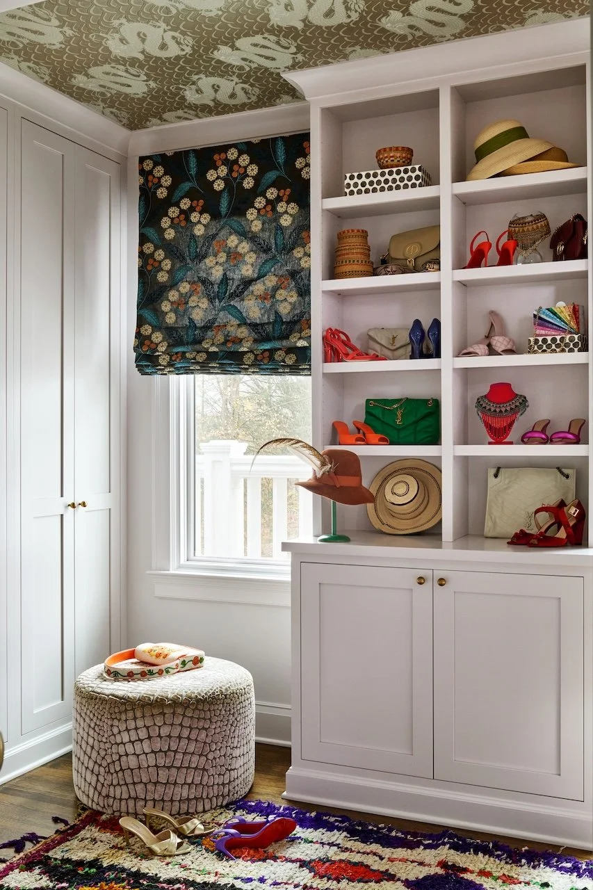 Custom closet dragon ceiling wallpaper floral roman shade white built ins croc ottoman colorful rug styled accessories