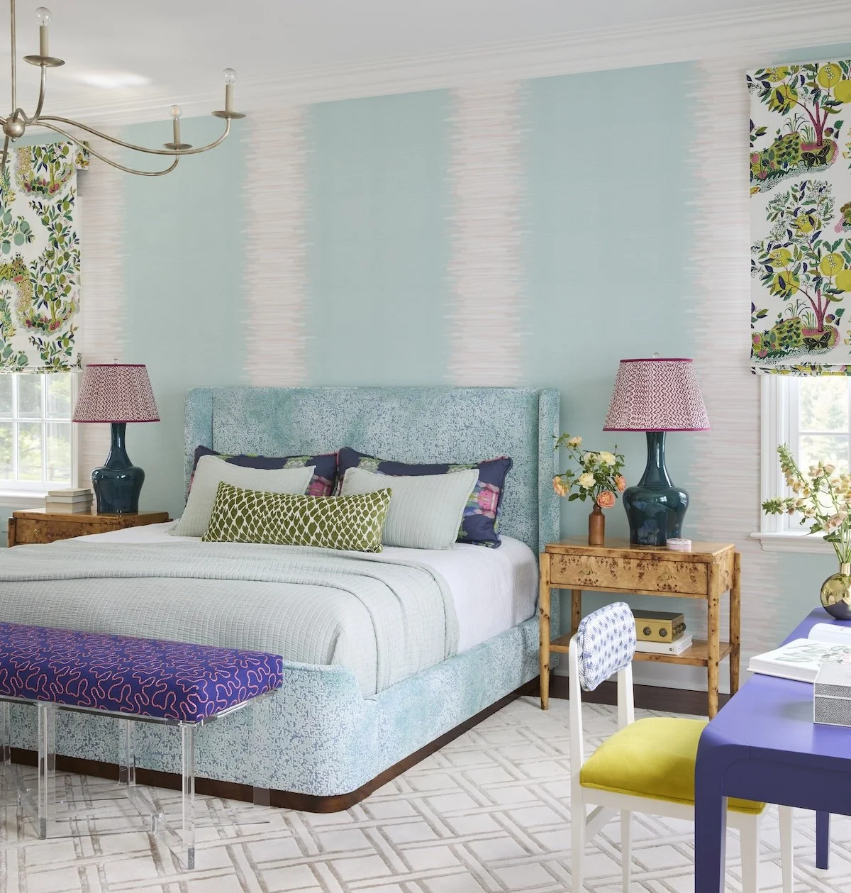 primary bedroom with mint ikat strie wallpaper turquoise upholstered bed citrus fruit roman shades and burl wood nightstands by betsy wentz