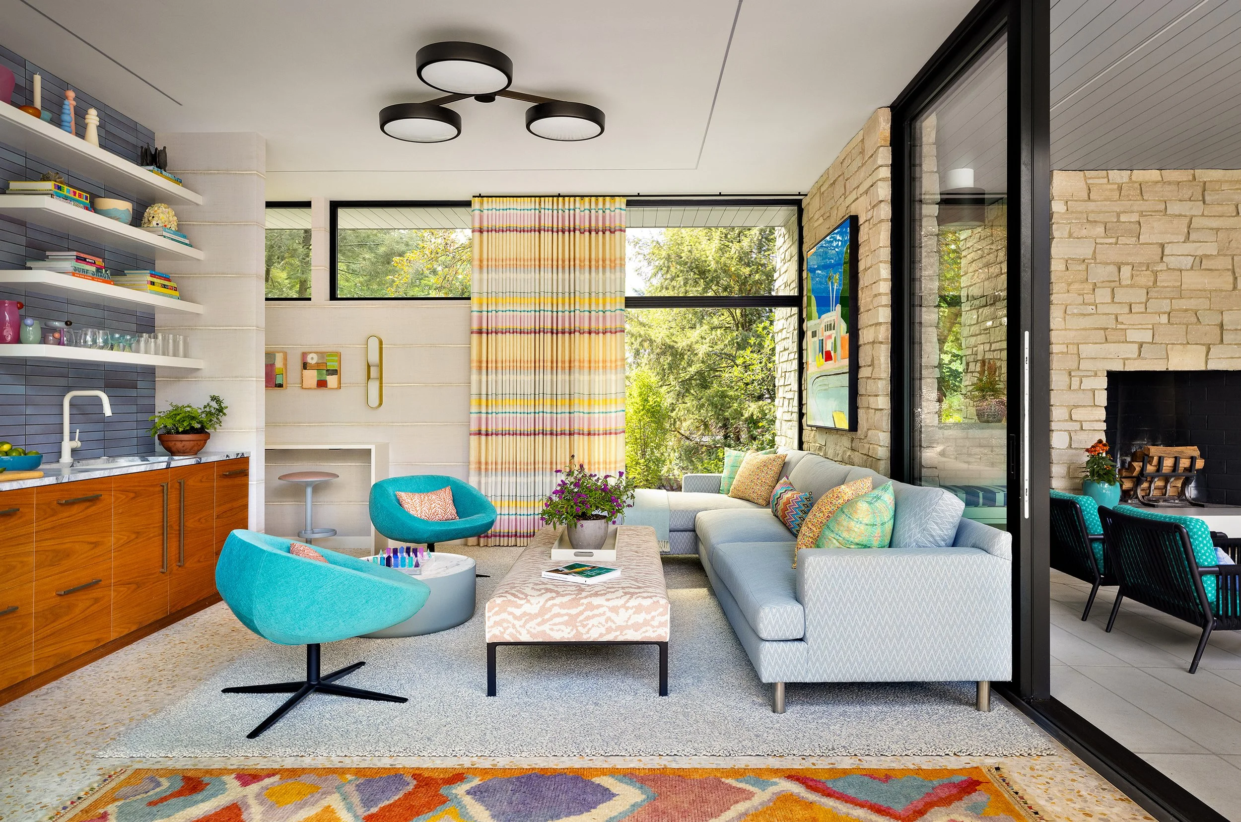 indoor outdoor living pool house seating area open to covered patio for outdoor dining