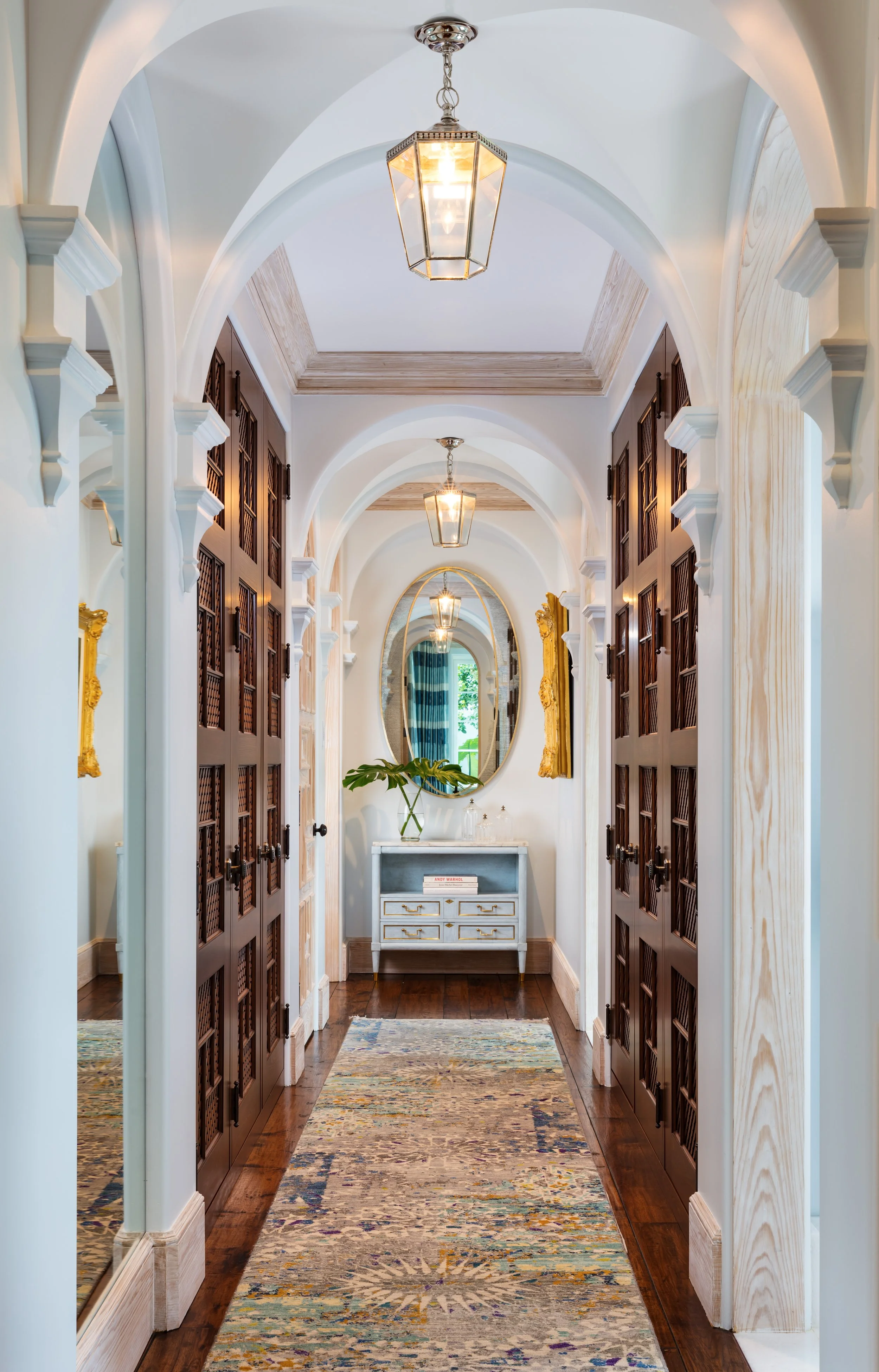 stunning-hallway-with-elegant-arches-artwork-and-custom-rugs.jpg