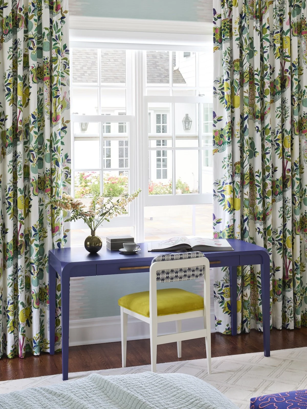 primary bedroom desk nook with purple lacquered desk, citrus fruit botanical curtains, yellow velvet chair by Betsy Wentz