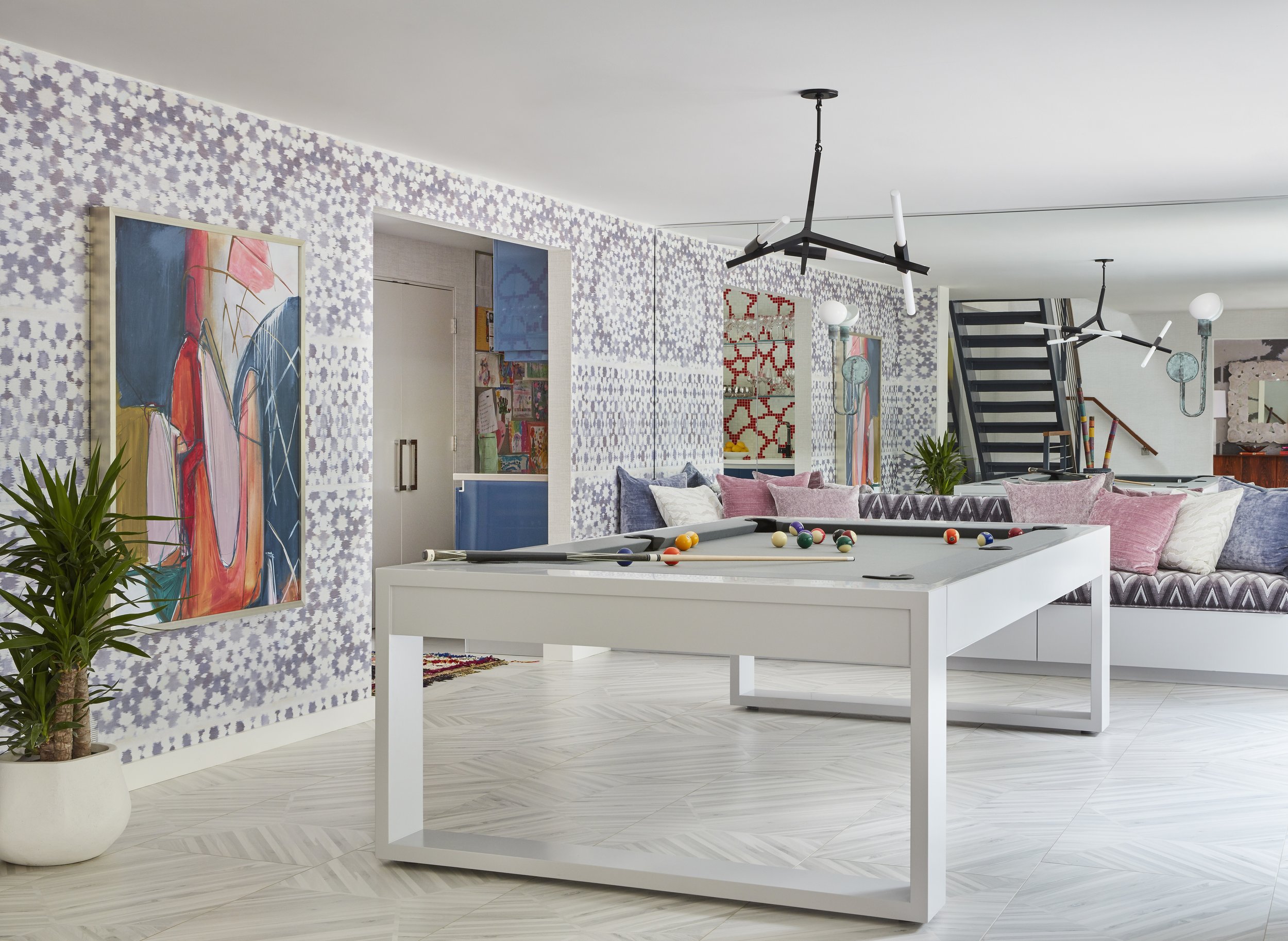 game room with pool table abstract art geometric wallpaper stylized seating and chic lighting for luxury interior design inspiration