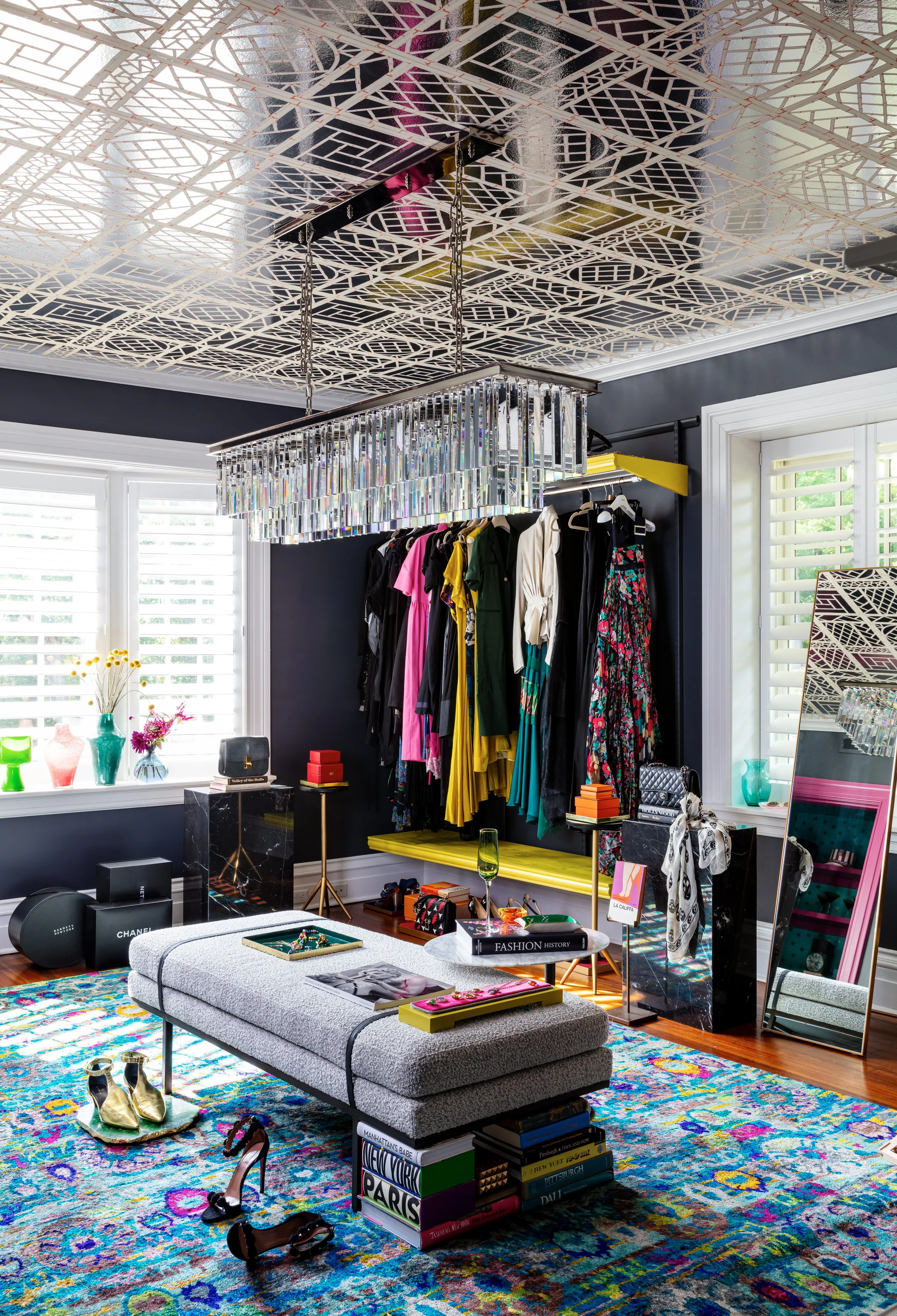 luxurious-primary-bedroom-closet-historic-home-clothes-lover-dream-organized-storage-display-statement-lighting.jpg