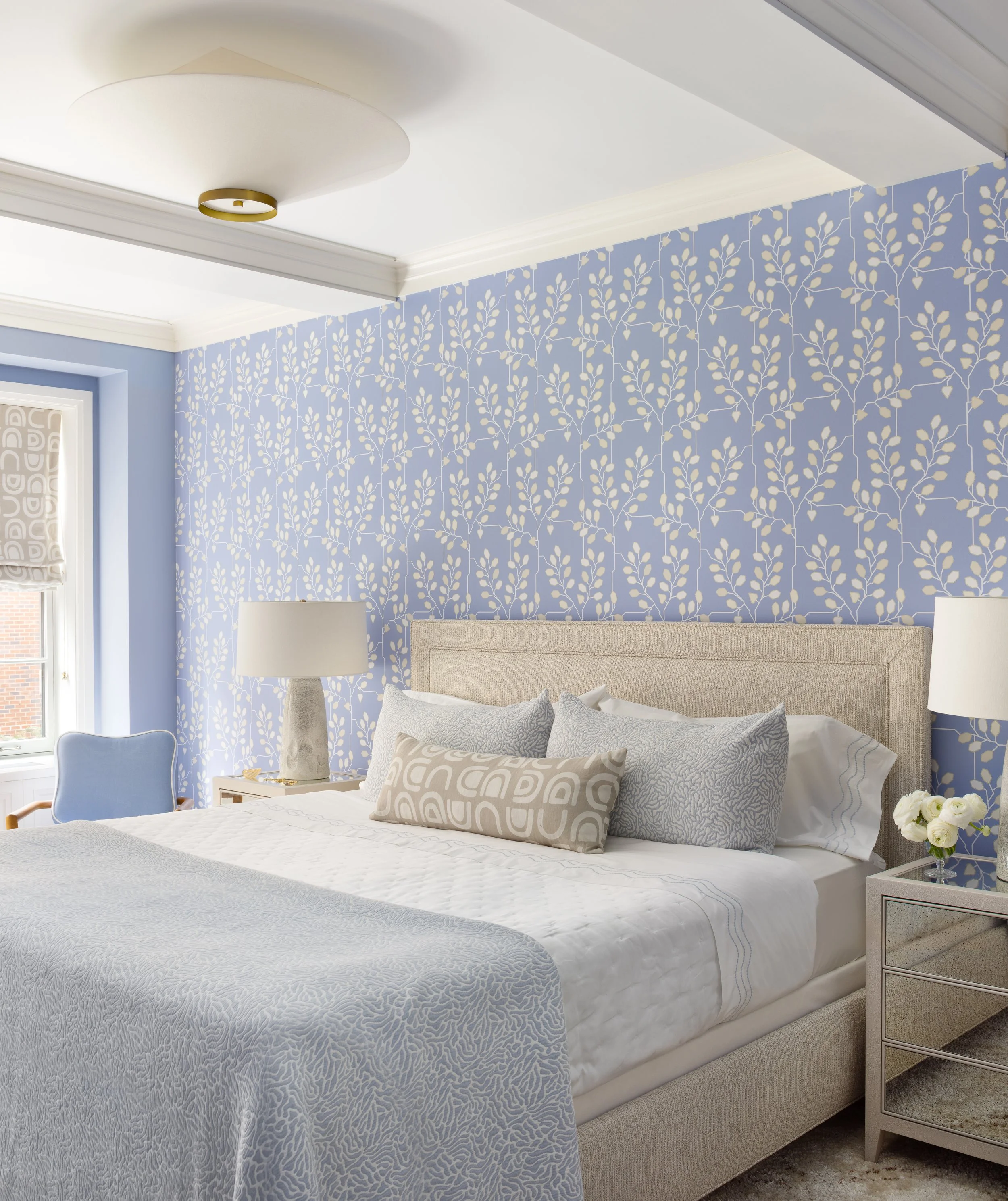 bedroom with king bed and soft purple statement wallpaper elegant bedding