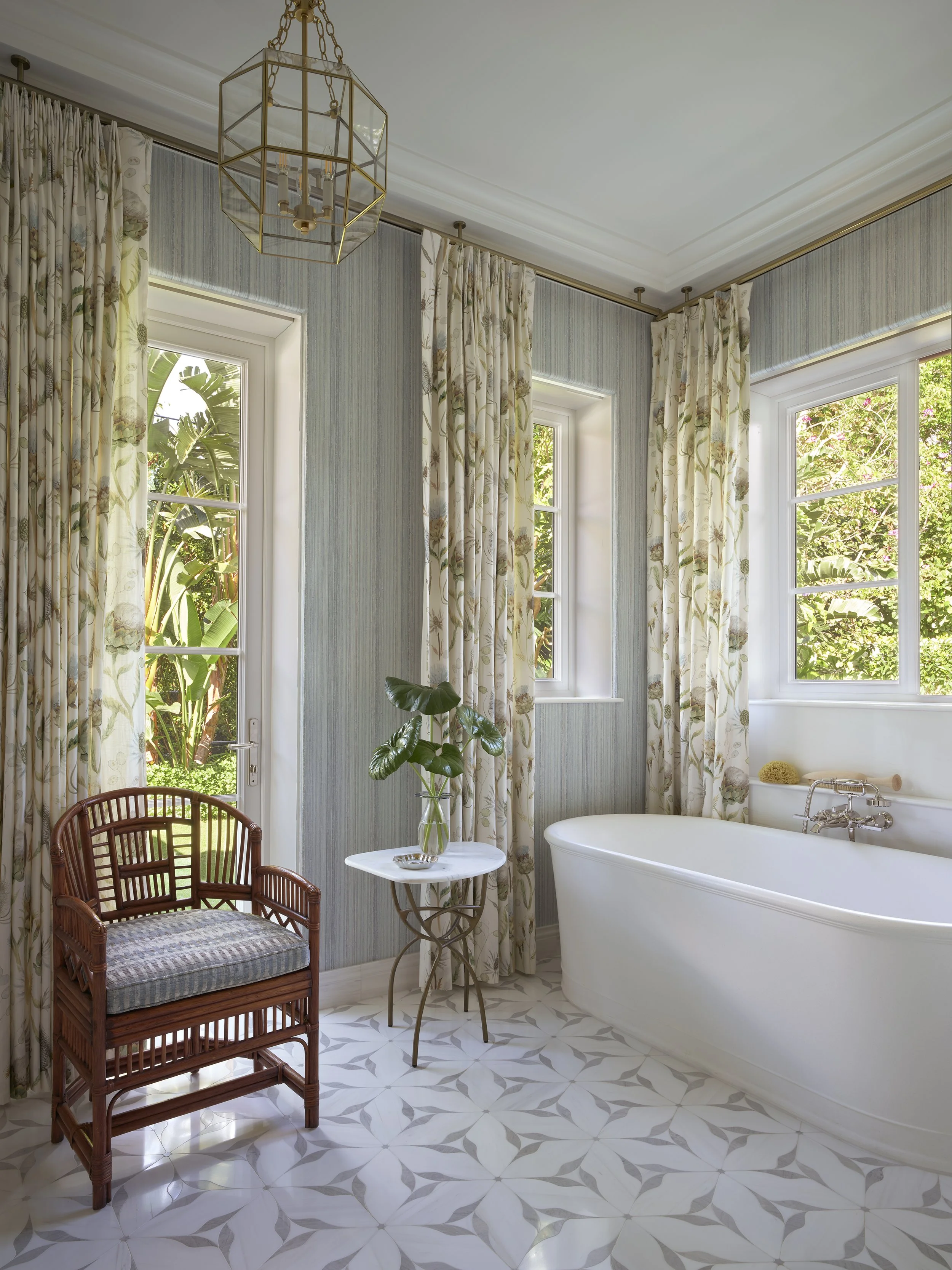 bathroom design white bathtub floral curtains rattan chair gold light fixture luxury home décor