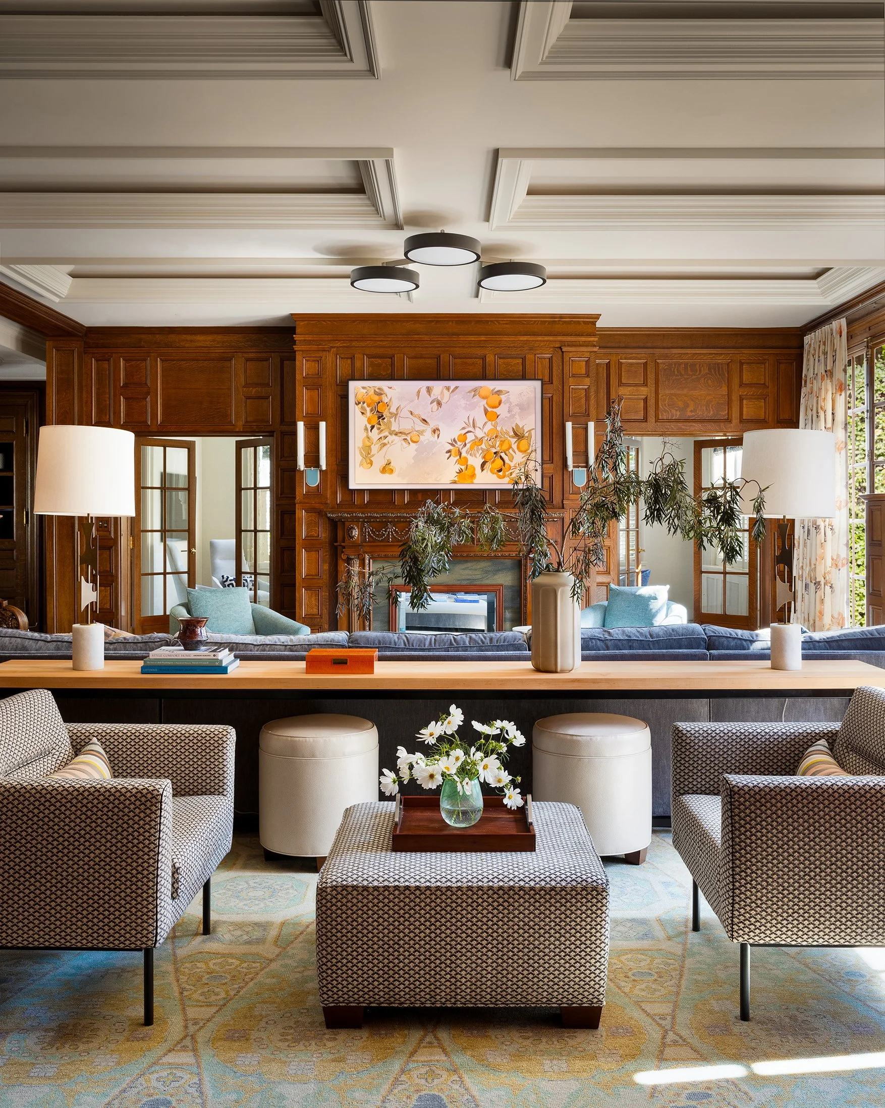 warm family room wood paneled walls modern comforts large sectional seating kid friendly vibes