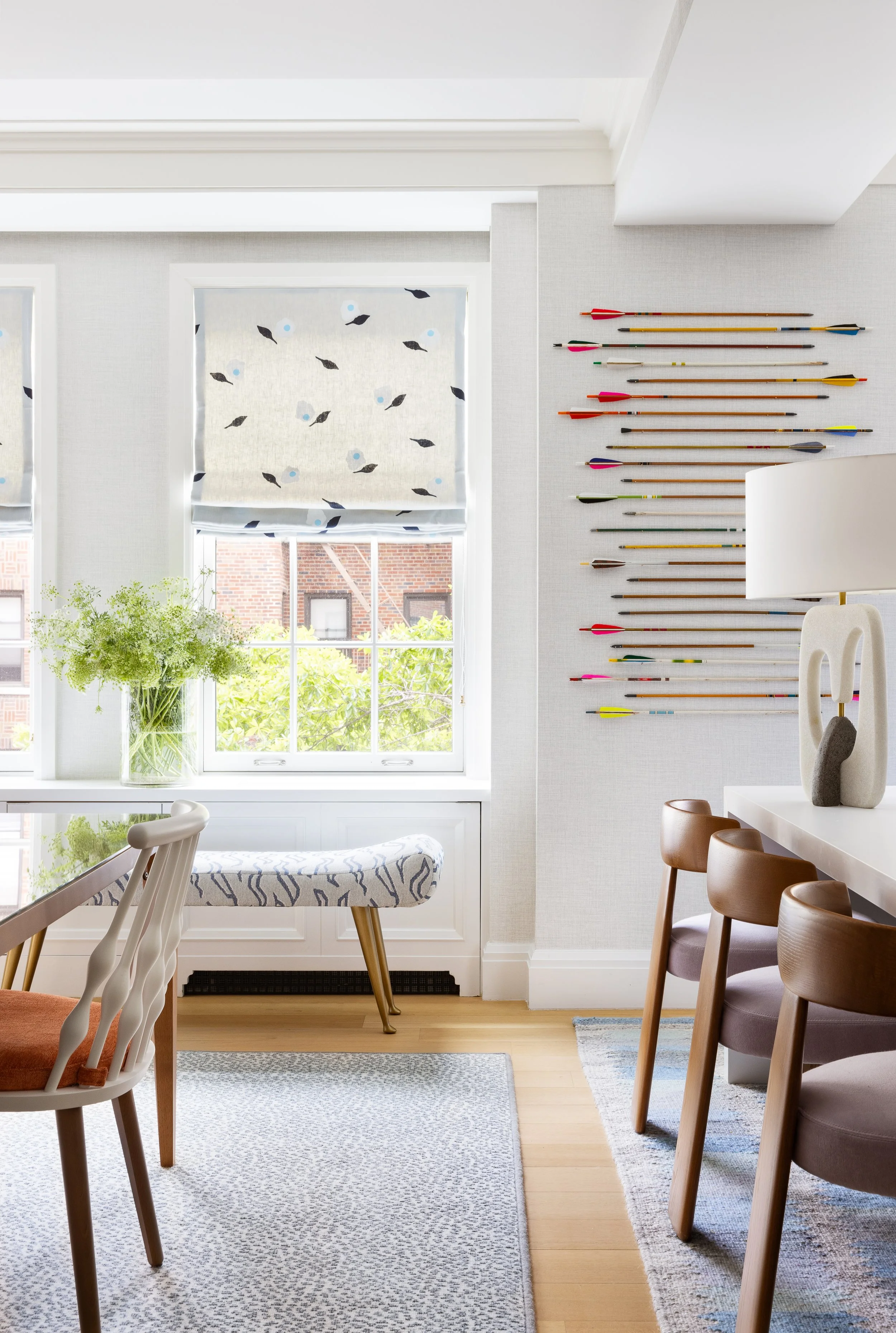 light filled family room with window treatments and statment artwork