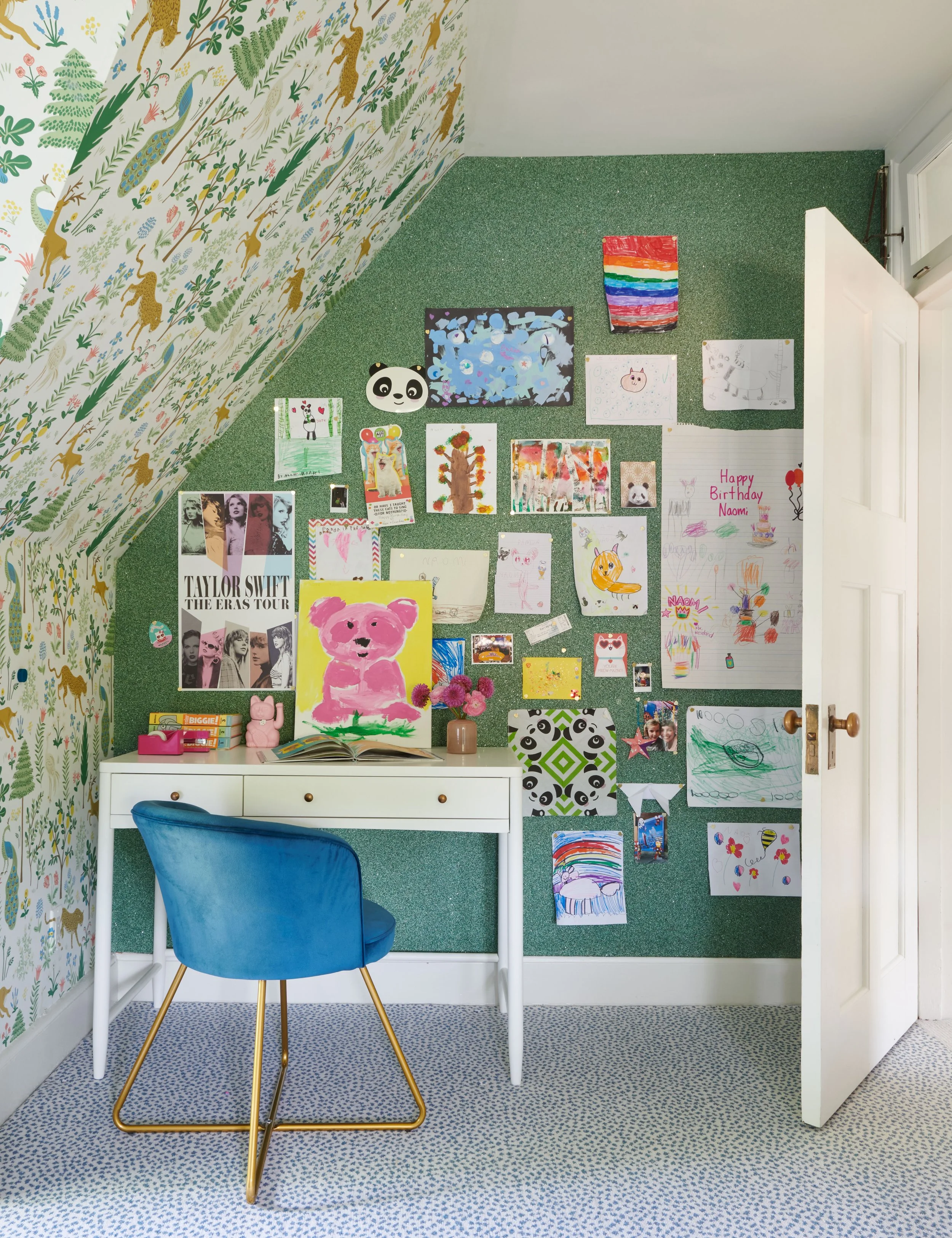 cozy-kids-study-area-with-desk-and-wallpaperd-corkboard-wall-for-art.jpg
