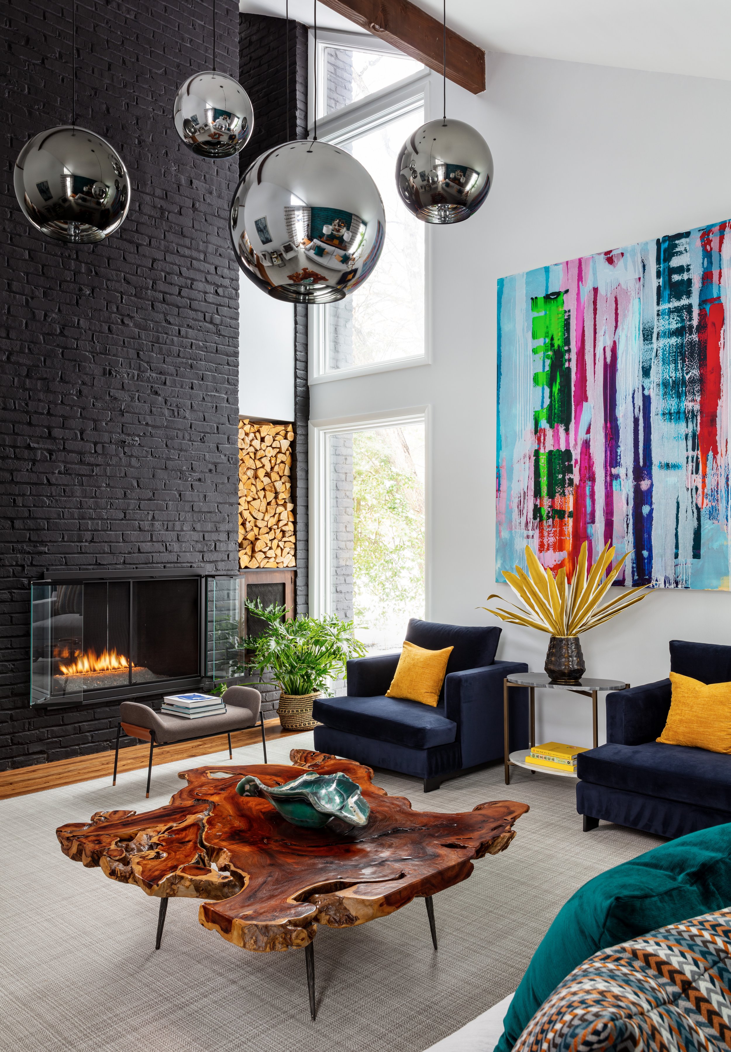 modern-living-room-design-black-brick-fireplace-sphere-pendant-lights.jpeg