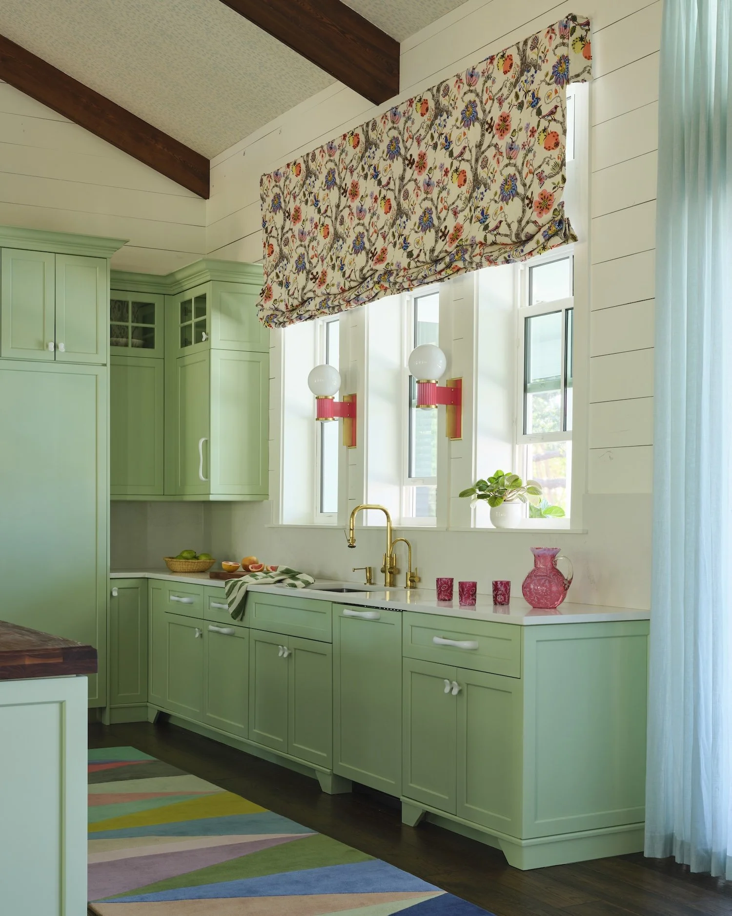 15-florida-kitchen-mint-green-cabinets-floral-roman-shade-colorful-rug-brass-fixtures-coastal-designjpg.jpg