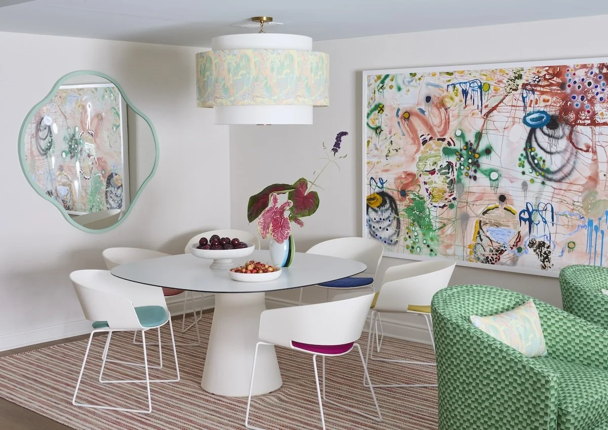 playful gameroom dining with white tulip table abstract art wavy mint mirror patterned drum pendant green checkered chairs by betsy wentz