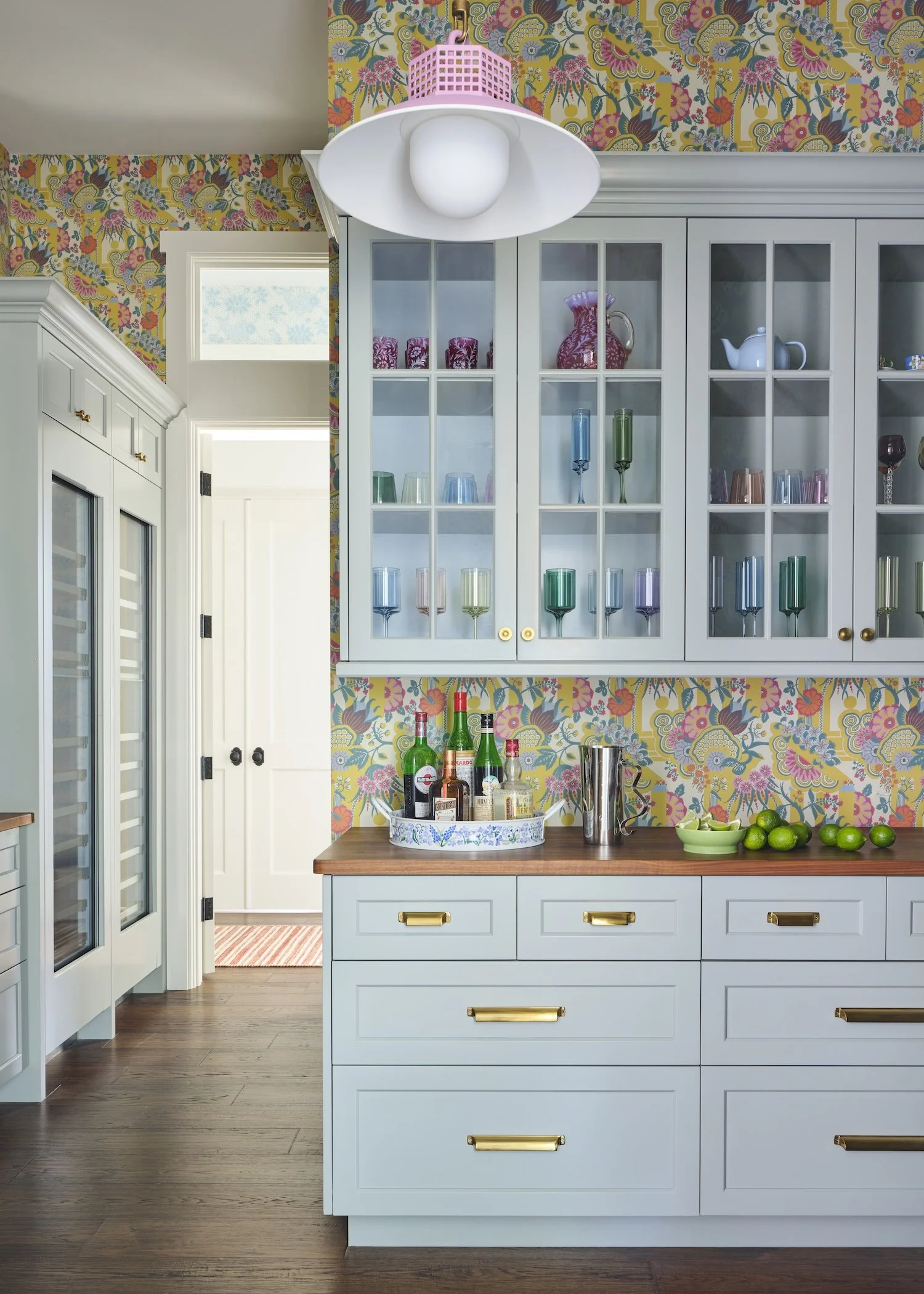 16-florida-bar-floral-wallpaper-light-blue-cabinets-colorful-glasses-wine-fridge-vibrant-home-design.jpg