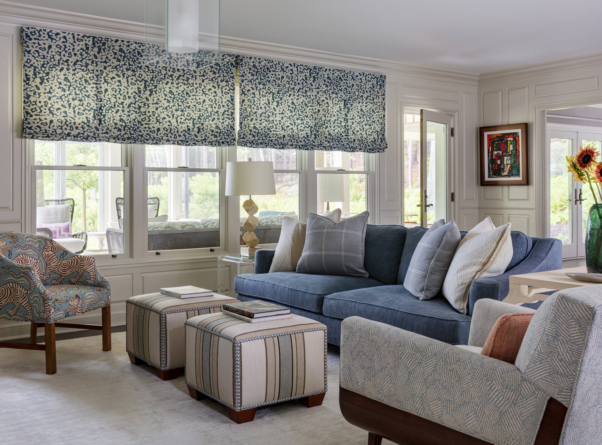 stylish-blue-gray-living-room-with-patterned-window-shades-blue-sofa.jpg
