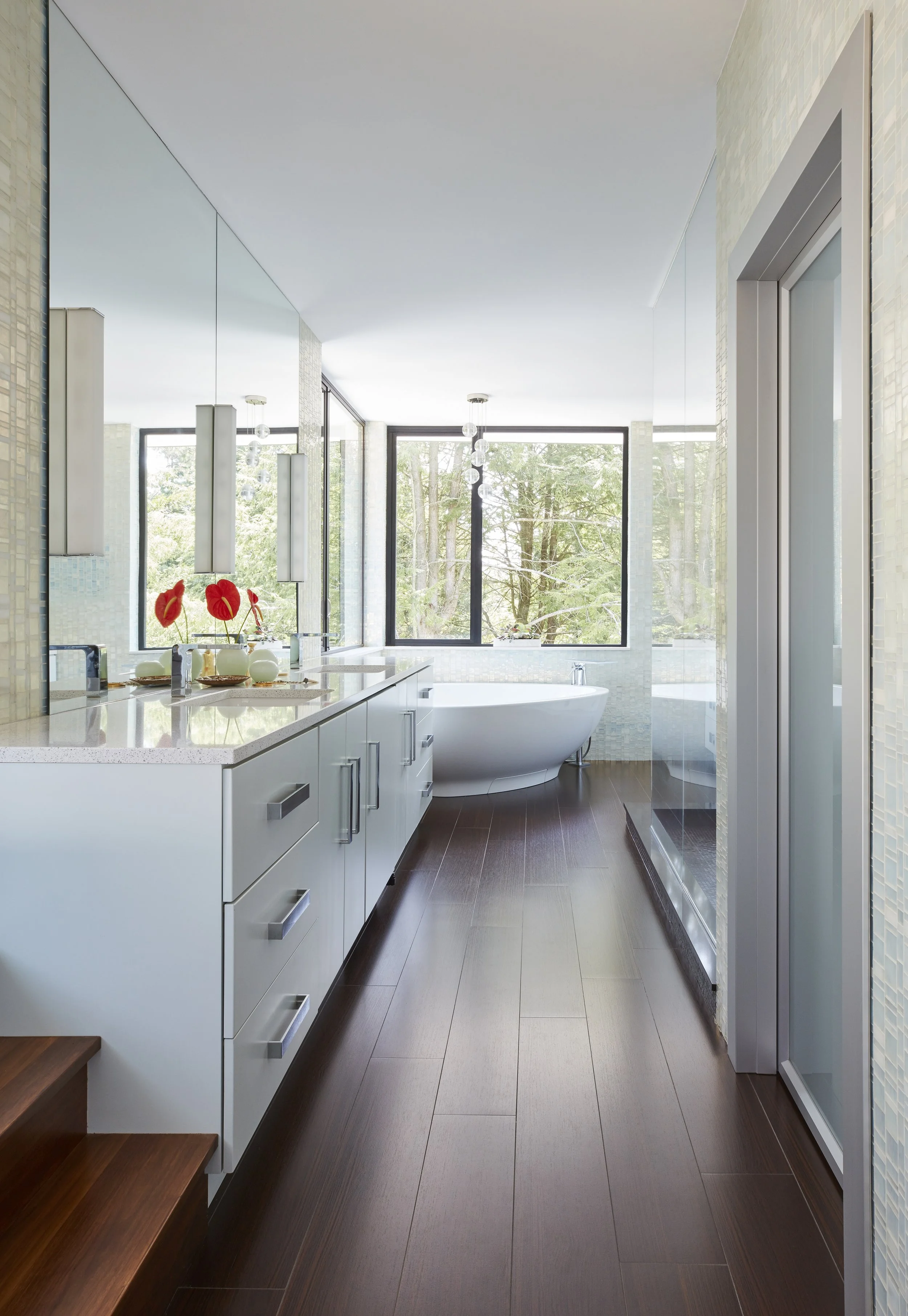 sleek bathroom with double vanity soaking tub and separate shower 