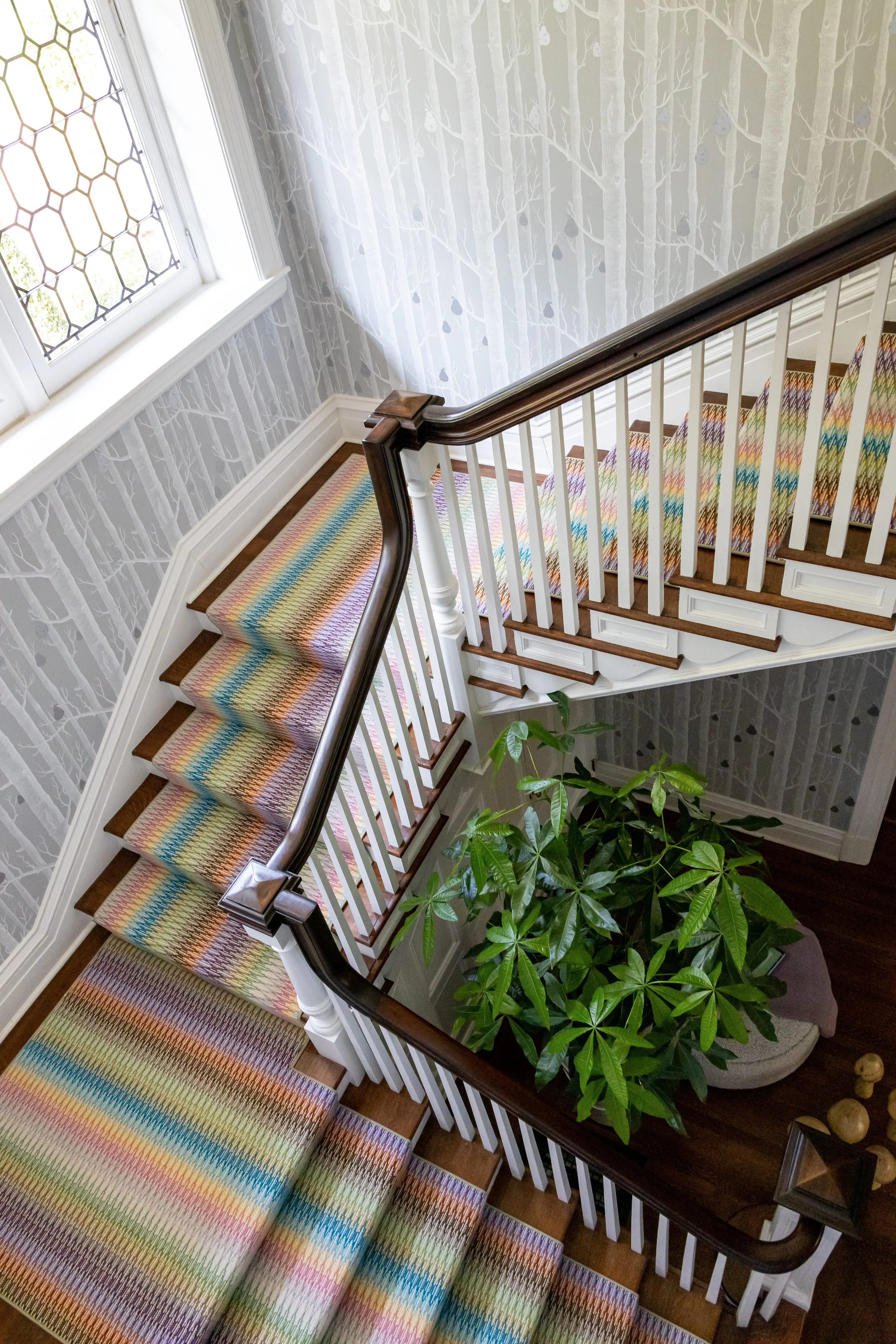 historic-home-stairway-modern-update-with-colorful-carpet-runner-and-wallpaper.jpg