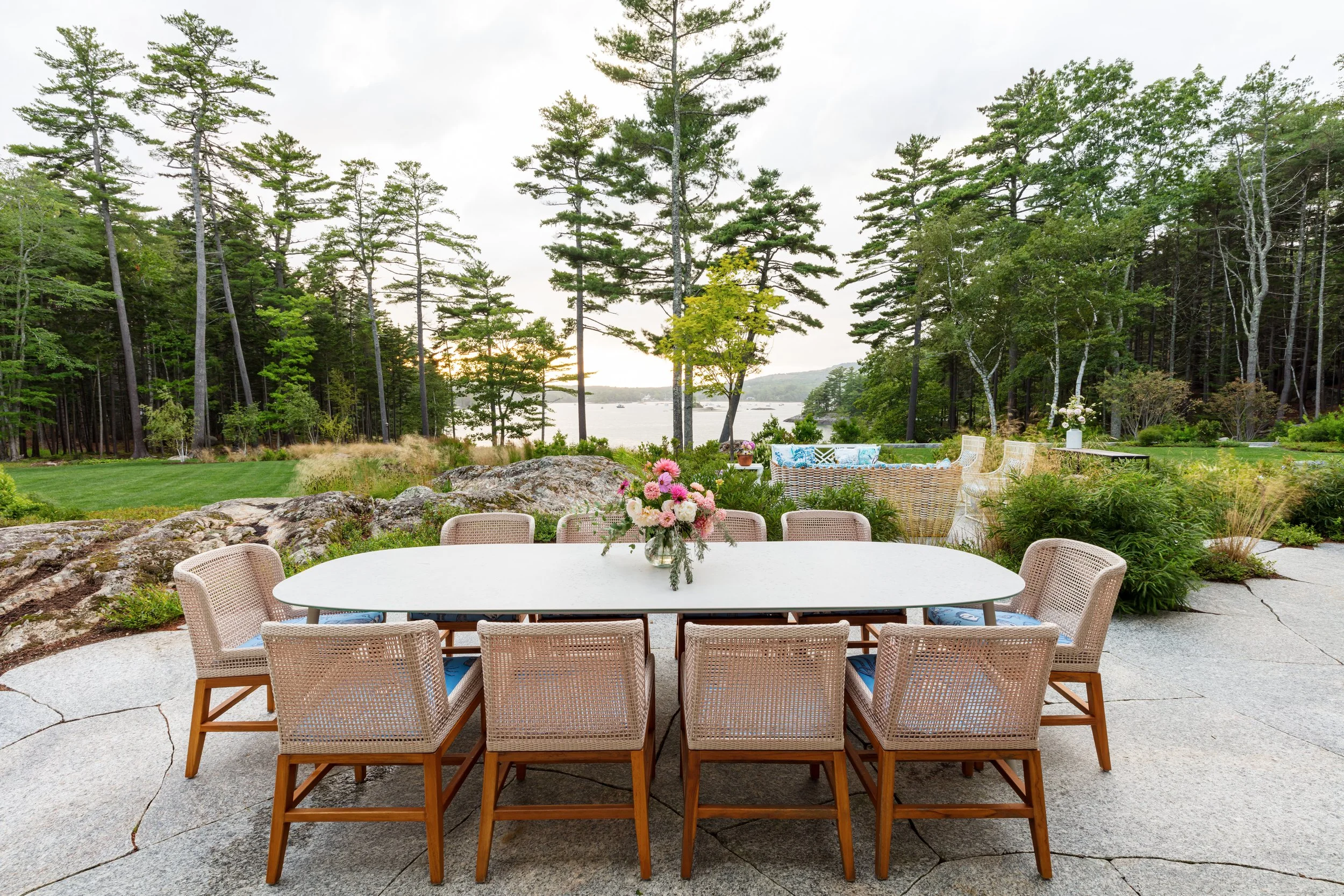 outdoor-dining-setting-with-oval-white-table-and-wicker-chairs-elegant-al-fresco-entertaining.jpg