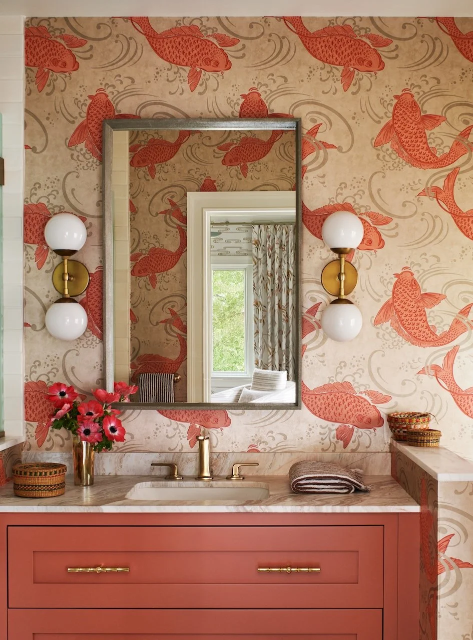 Coral vanity koi wallpaper marble countertop globe sconces silver mirror brass faucet bamboo hardware fresh blooms
