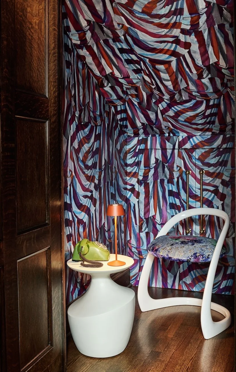 dramatic nook with wallpaper and chair