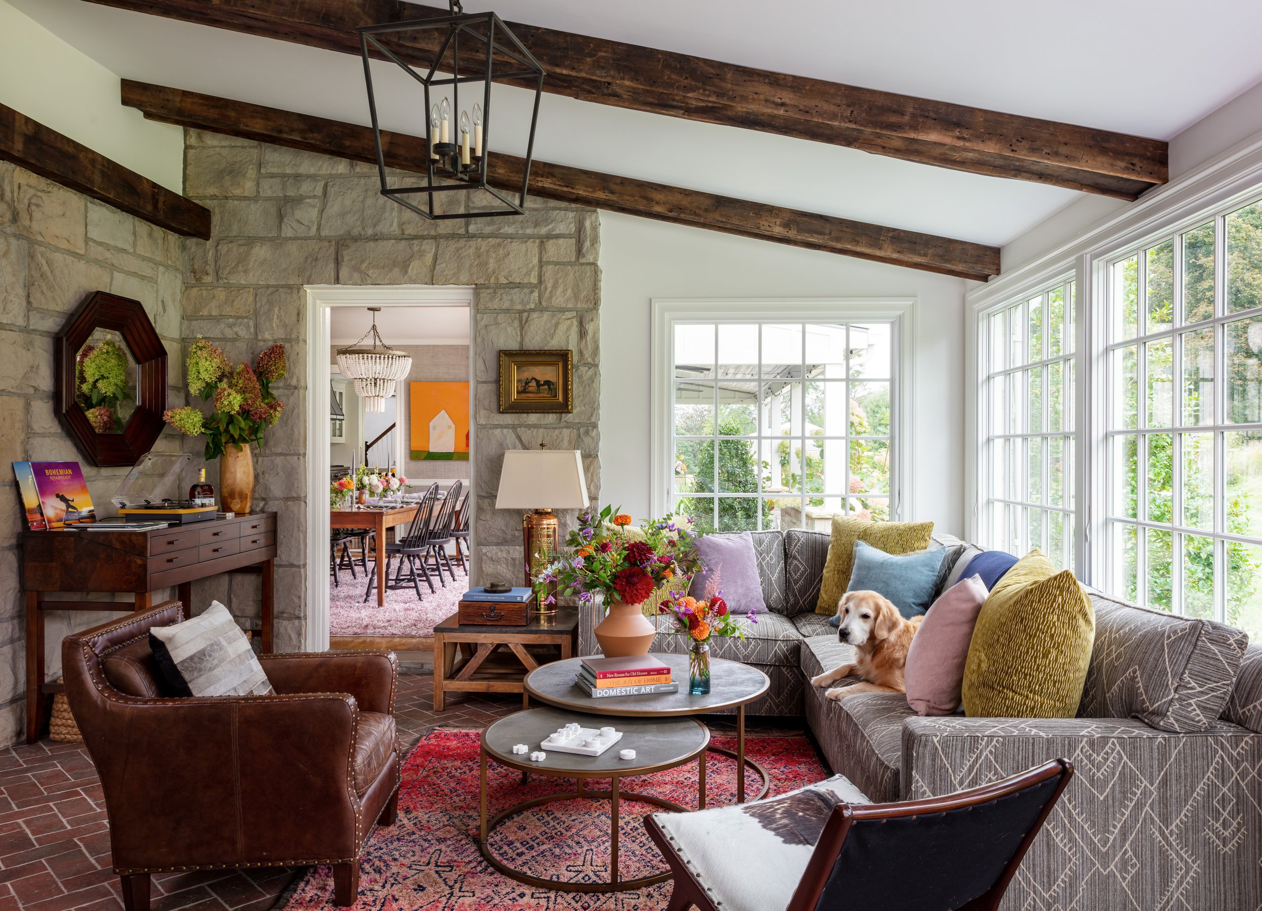 cozy family room with sectional seating colorful pillows and leather lounge chair