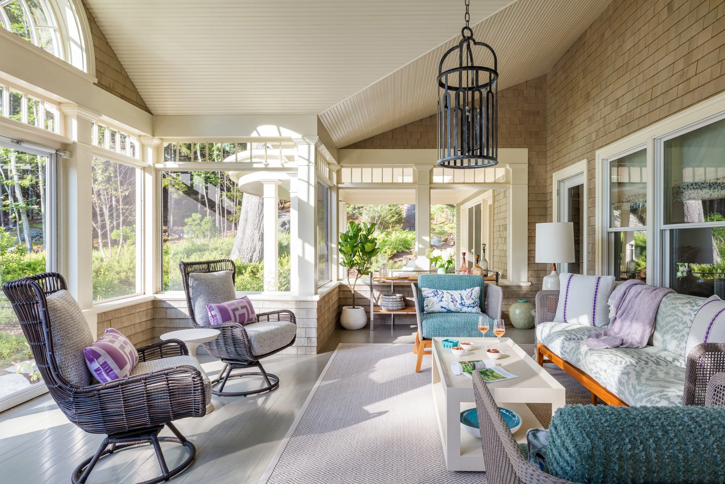 enclosed-sunroom-wicker-chairs-interior-design-porch-styling.jpg