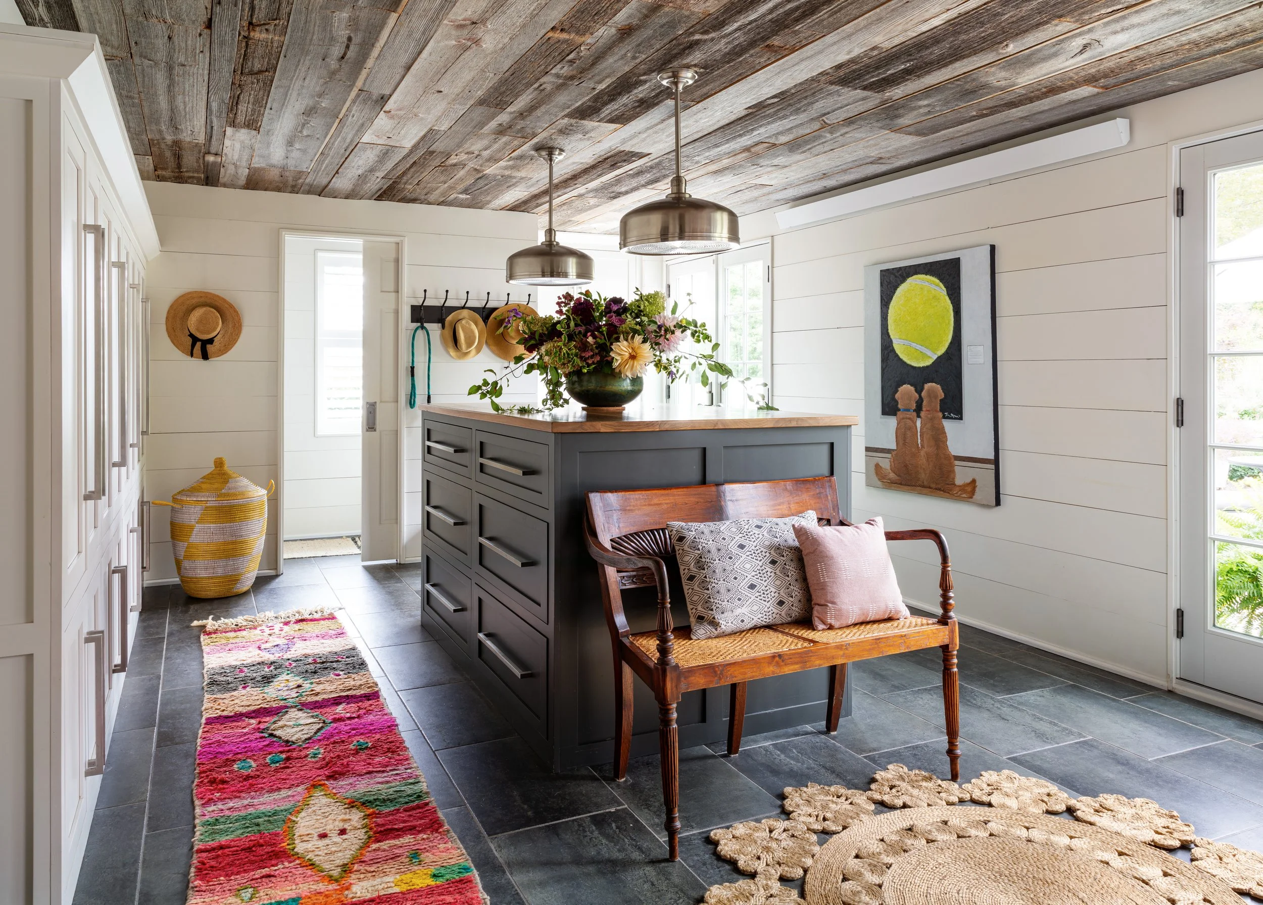 farmhouse mudroom with island storage lockers wood slat ceiling and bench