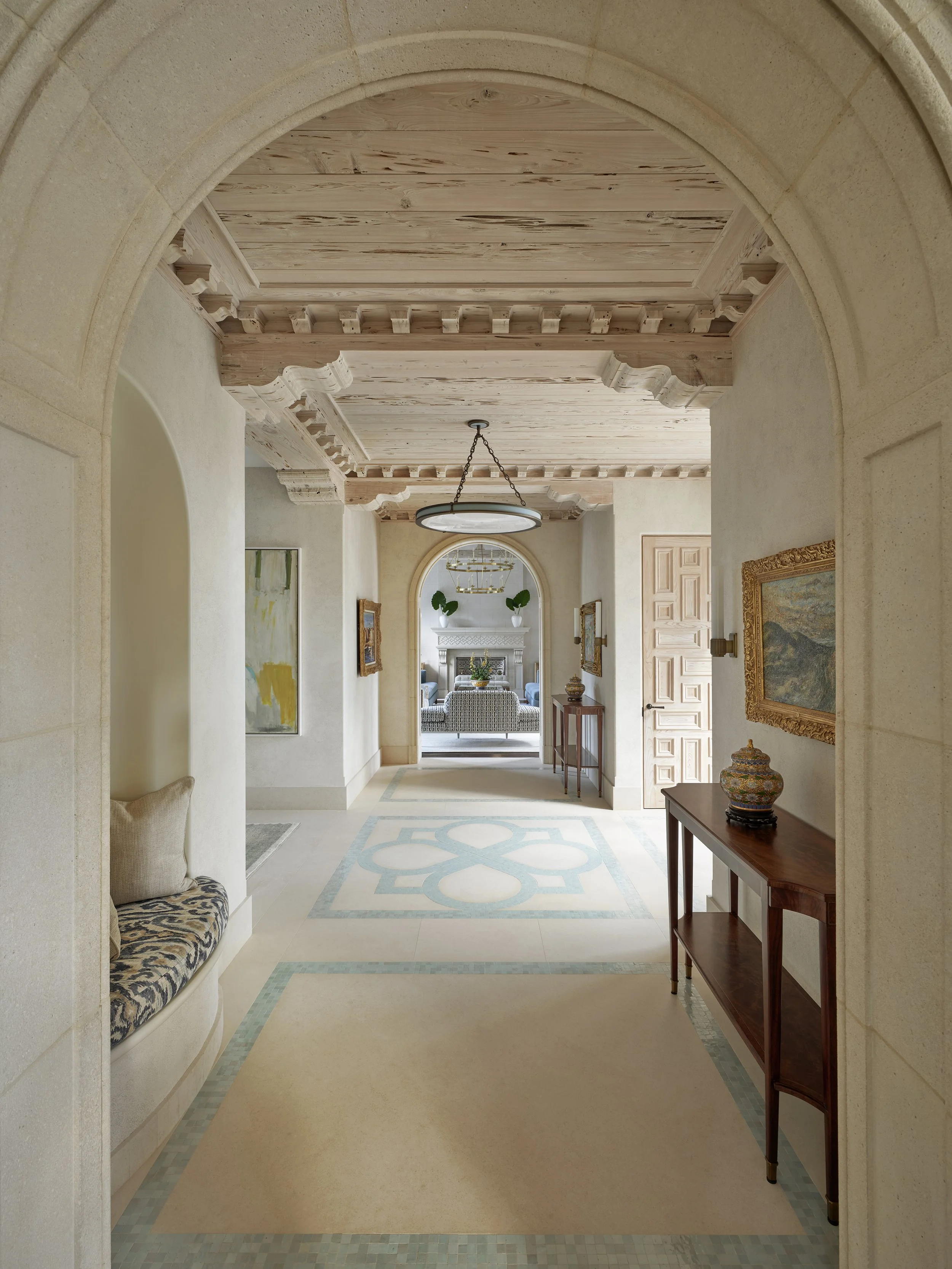 arched hallway design beige stone arches wooden ceiling blue patterned floor mediterranean entryway