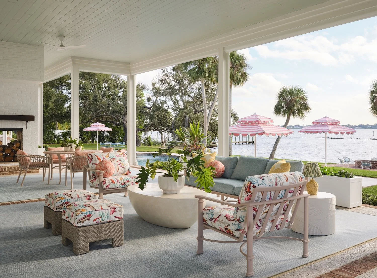 54-covered-patio-outdoor-living-florida-style-pink-umbrellas-waterfront-furniture-colorful-design-coastal-retreat.jpg