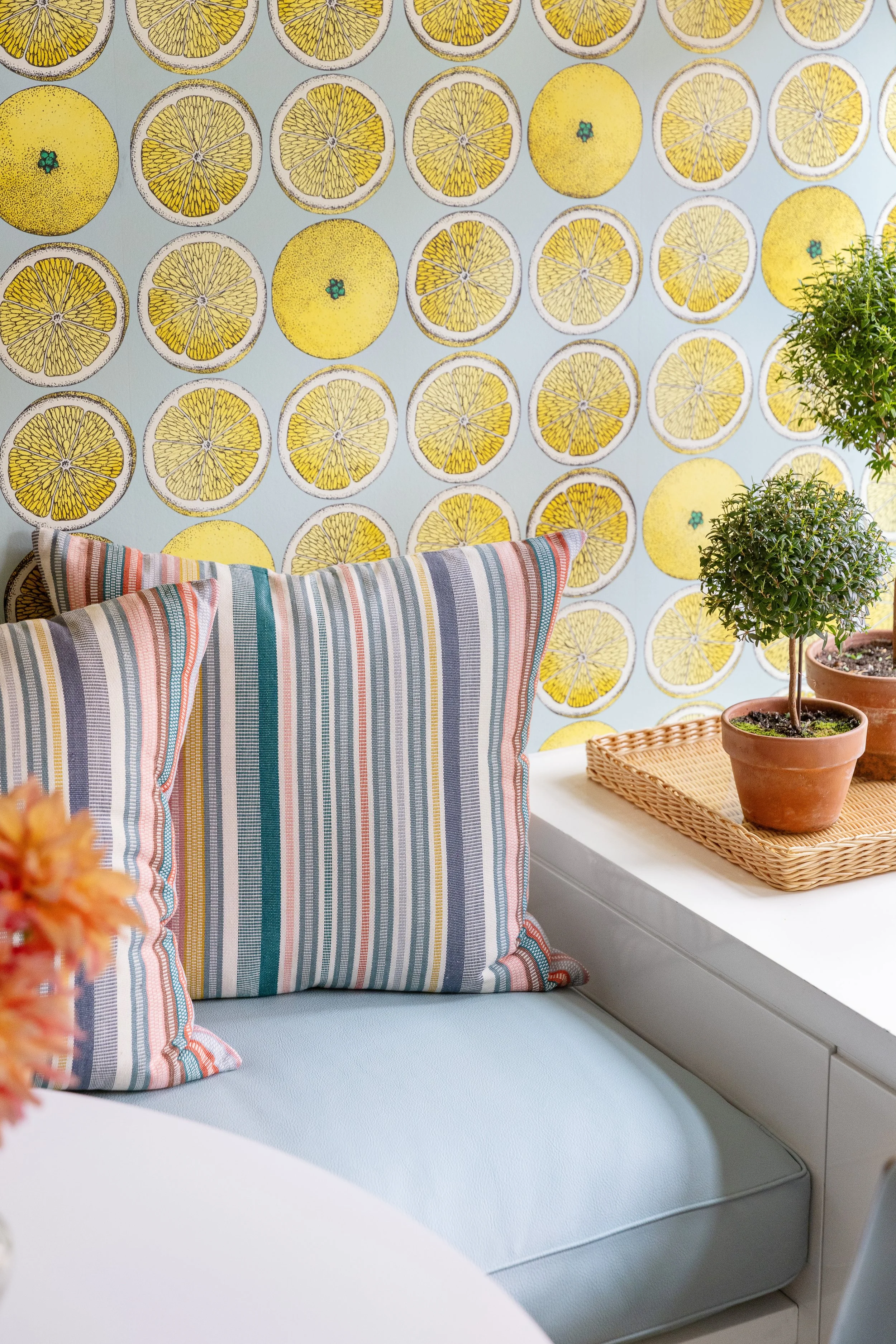 built in banquette with cushion and striped pillows for breakfast area