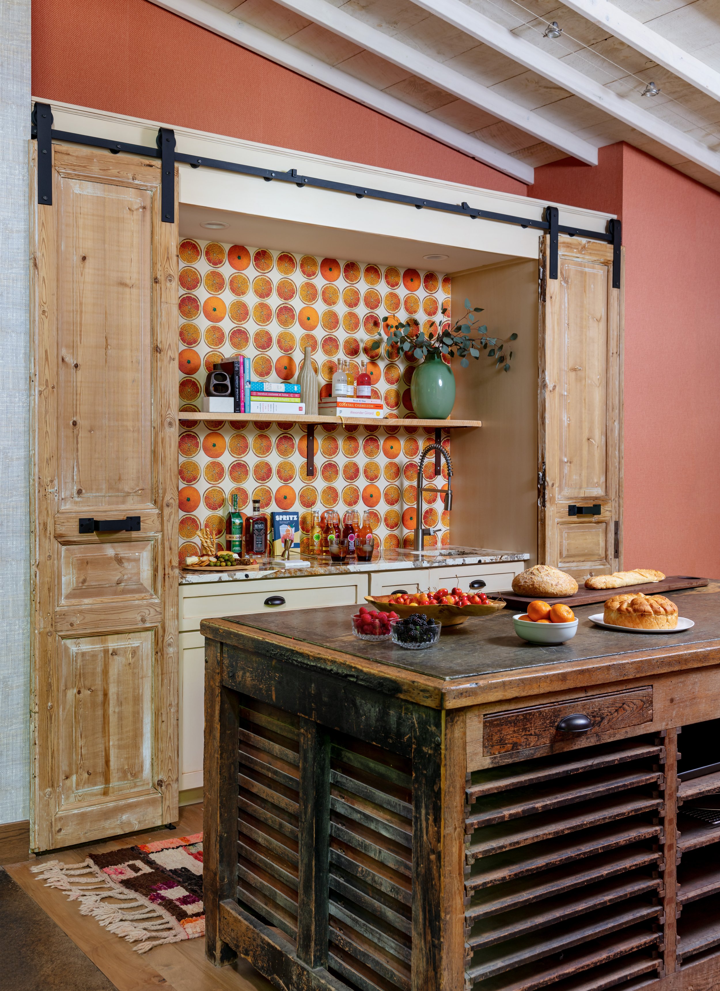 rustic‑modern‑kitchen‑with‑reclaimed‑wood‑sliding‑barn‑doors‑and‑vibrant‑orange‑patterned‑wallpaper‑featuring‑island‑for‑kitchen‑design‑inspiration‑and‑home‑renovation‑ideas.jpg